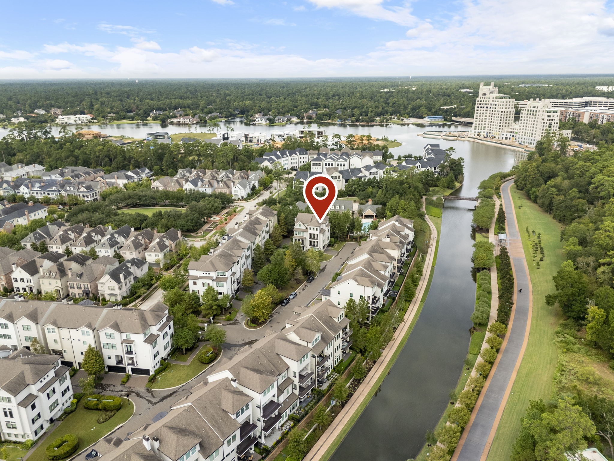 10 Nautical Terrace Way The Woodlands, TX 77380 - Photo 27 of 28 Bird's-eye view showcasing this end-unit residence within Waterway Landing, near the community pool, the scenic Waterway and its landscaped walking paths, with Lake Woodlands and Town Center just beyond.