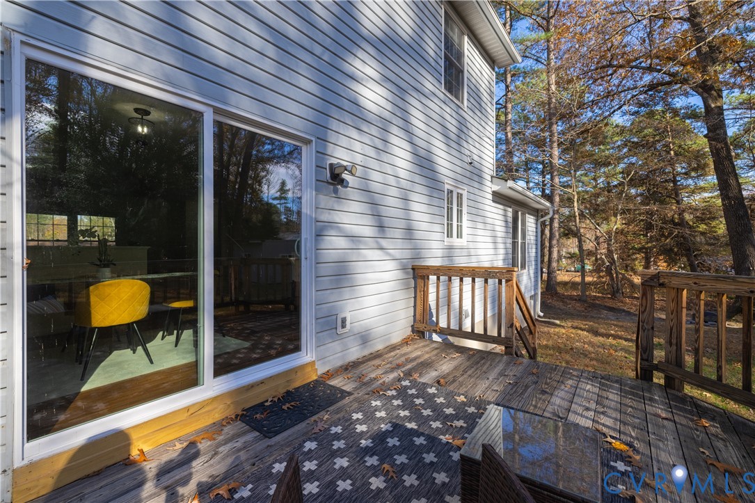 247 Tranquility Drive Ruther Glen, VA 22546 - Photo 16 of 50 a view of a house with backyard and sitting area