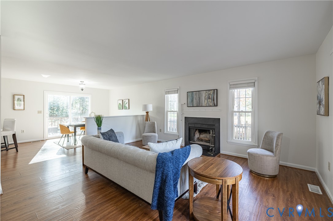 247 Tranquility Drive Ruther Glen, VA 22546 - Photo 17 of 50 a living room with furniture and a fireplace