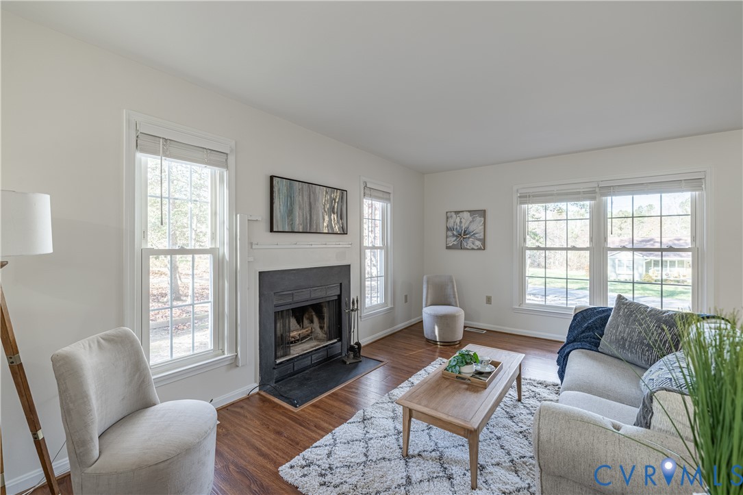 247 Tranquility Drive Ruther Glen, VA 22546 - Photo 18 of 50 a living room with furniture a fireplace a window and a couch