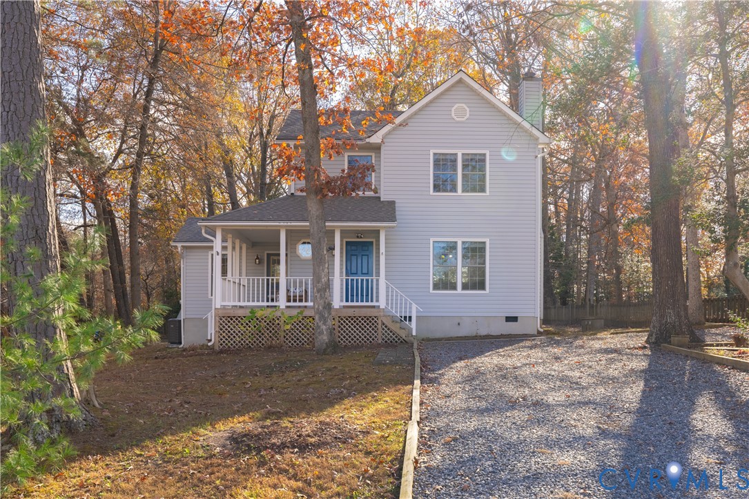 247 Tranquility Drive Ruther Glen, VA 22546 - Photo 2 of 50 front view of a house with a yard