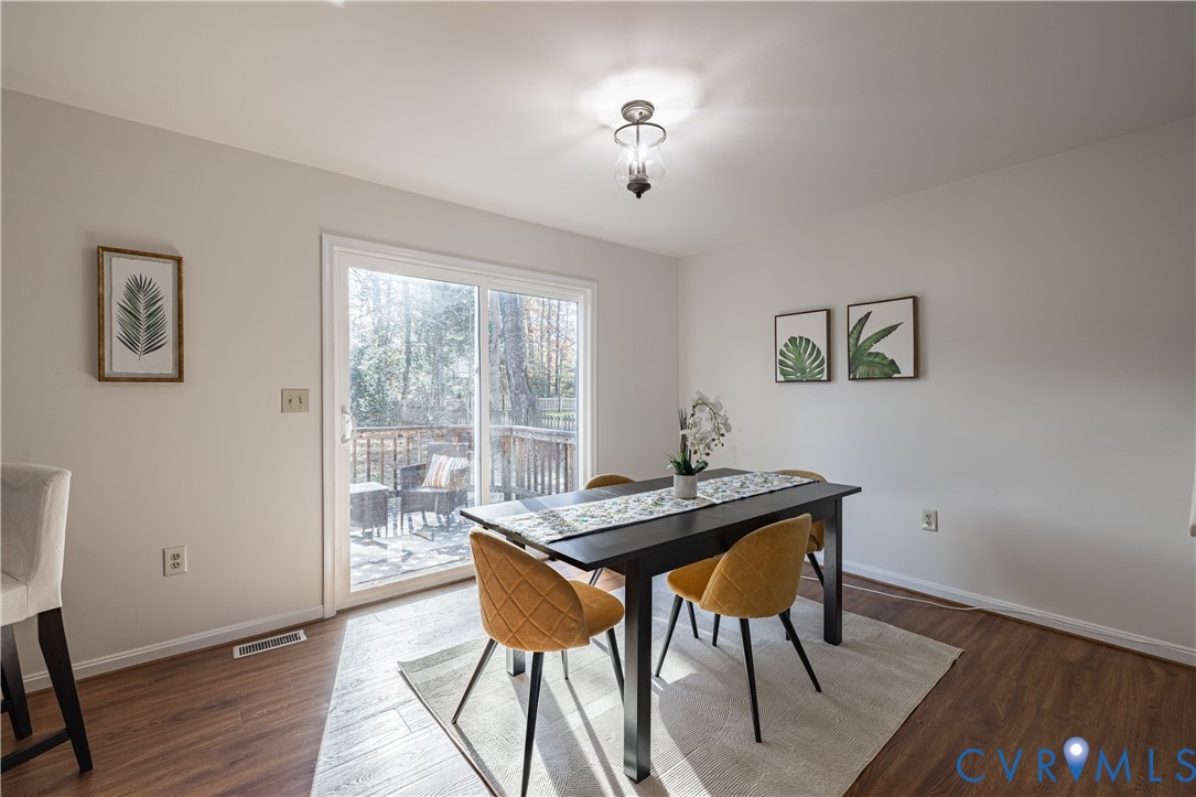 247 Tranquility Drive Ruther Glen, VA 22546 - Photo 21 of 50 a view of a dining room with furniture and wooden floor