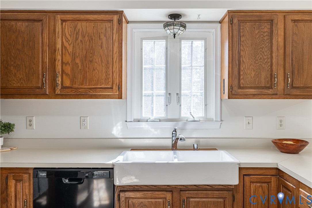 247 Tranquility Drive Ruther Glen, VA 22546 - Photo 28 of 50 a kitchen with stainless steel appliances granite countertop a sink a cabinets and a counter space