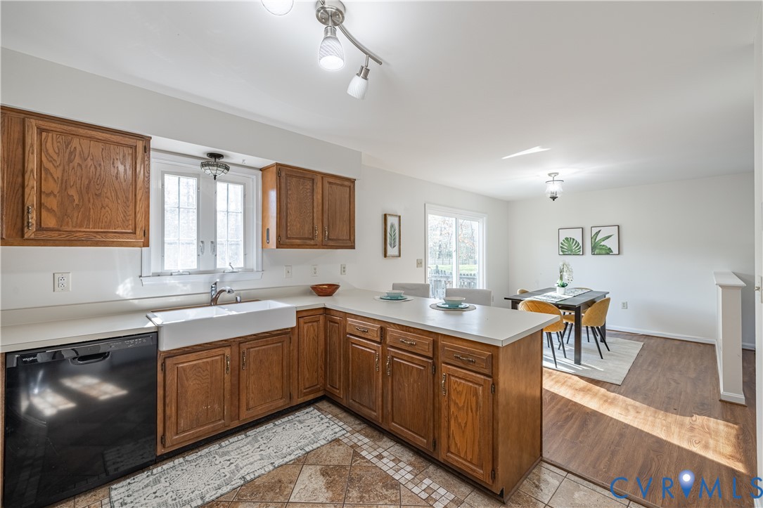 247 Tranquility Drive Ruther Glen, VA 22546 - Photo 29 of 50 a kitchen with a sink stove and cabinets
