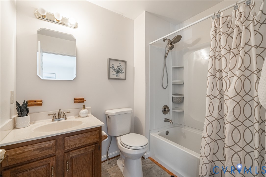 247 Tranquility Drive Ruther Glen, VA 22546 - Photo 40 of 50 a bathroom with a sink toilet and shower