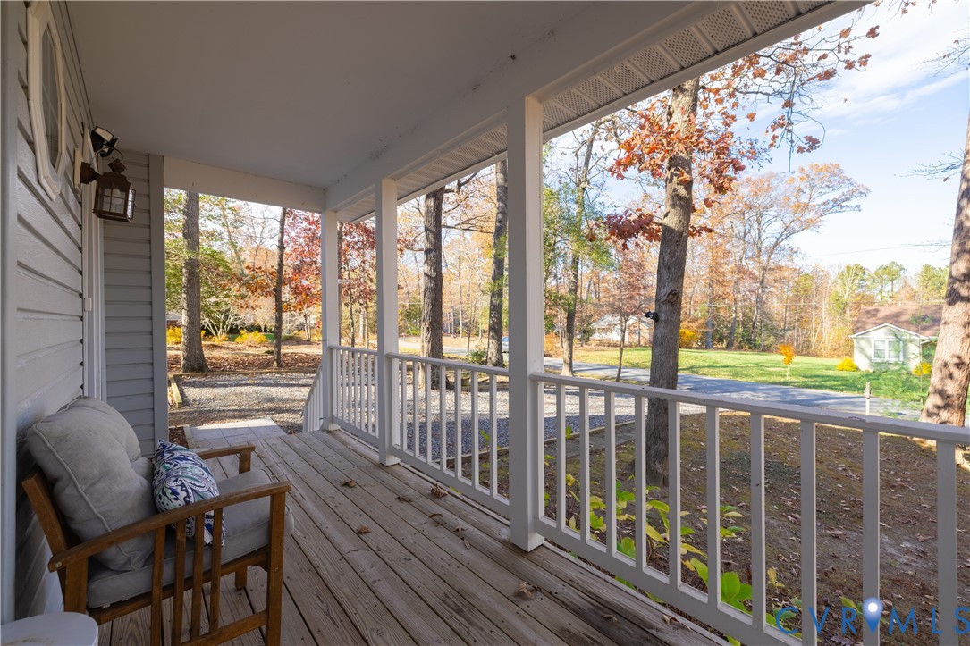 247 Tranquility Drive Ruther Glen, VA 22546 - Photo 8 of 50 a view of a porch with wooden floor and outdoor space