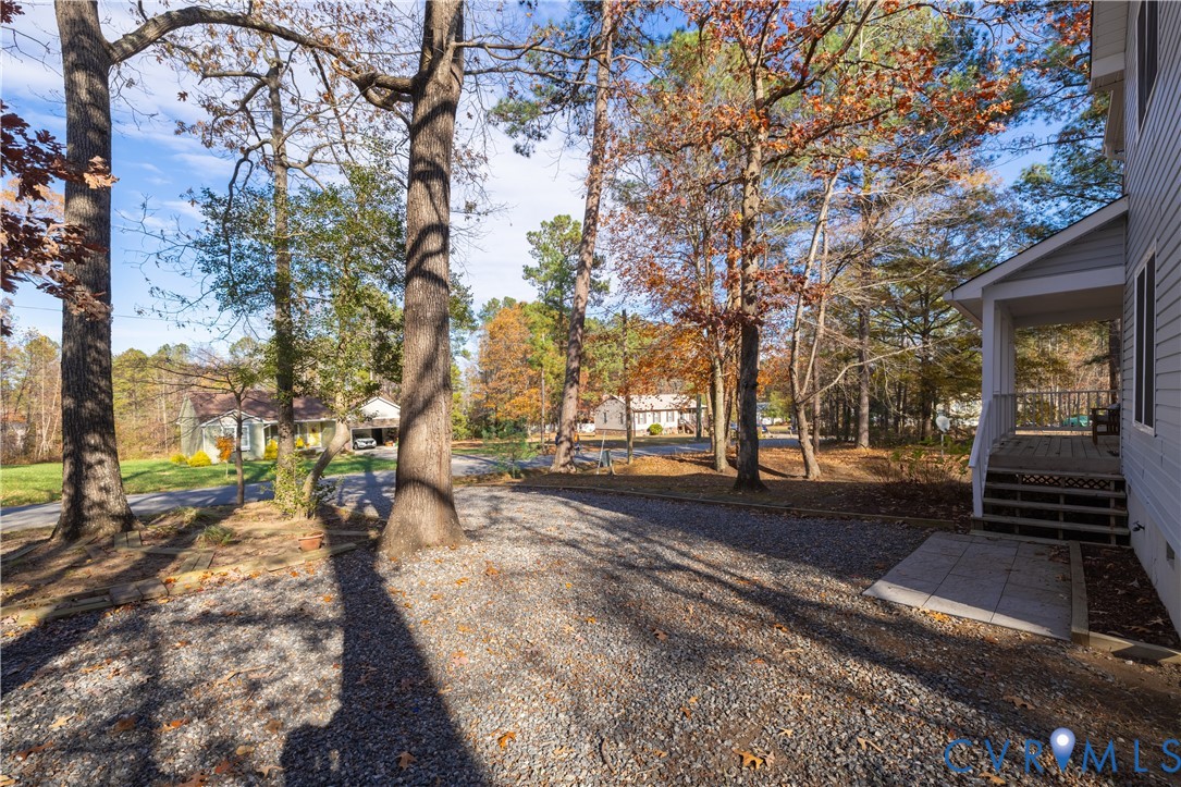 247 Tranquility Drive Ruther Glen, VA 22546 - Photo 9 of 50 a view of a yard with tree s