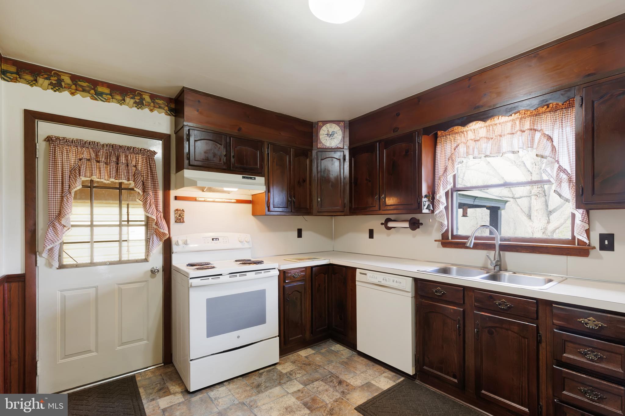 41 Apache Lane Willow Street, PA 17584 - Photo 23 of 26 a kitchen with a stove sink and cabinets