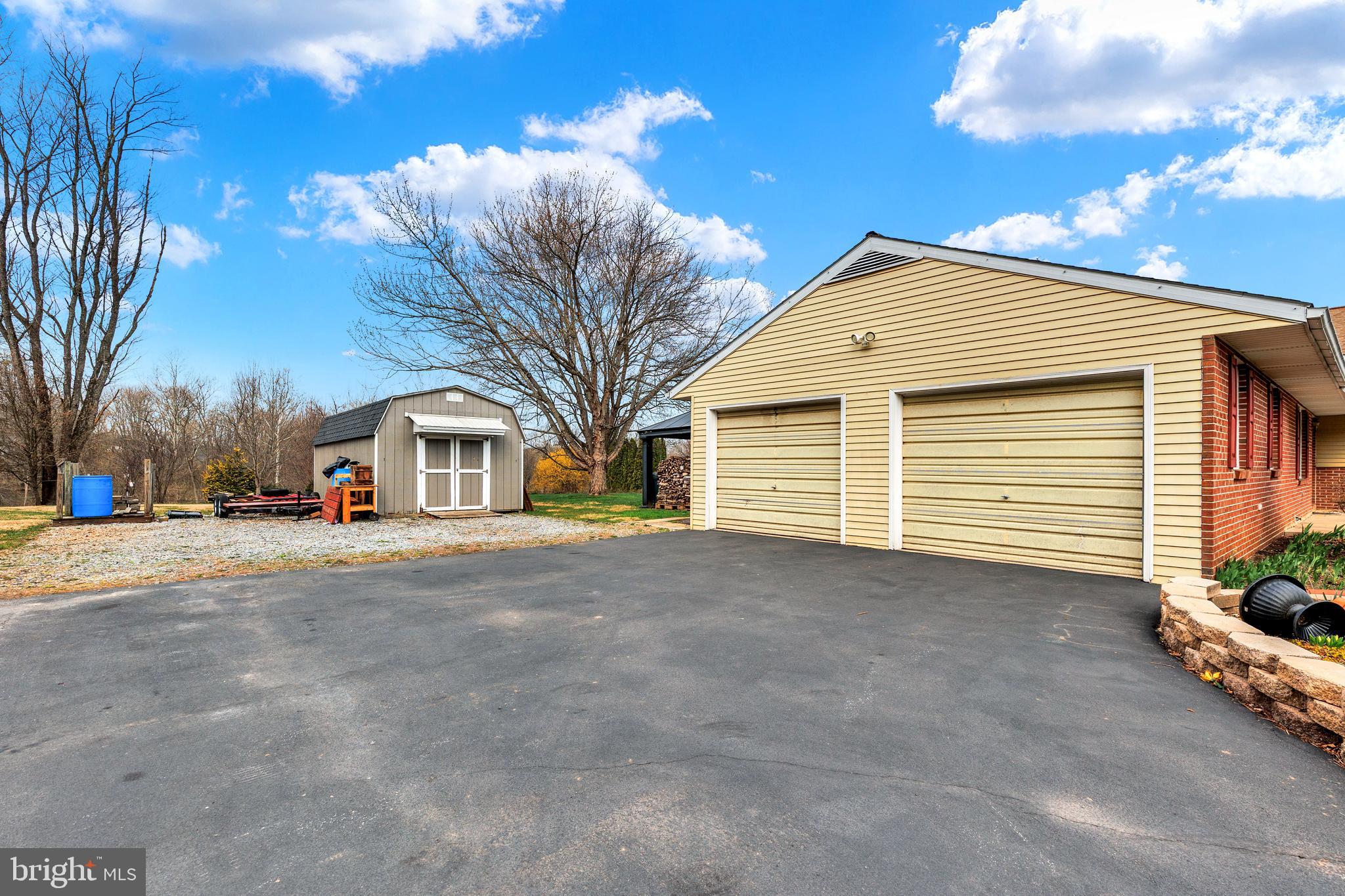 41 Apache Lane Willow Street, PA 17584 - Photo 25 of 26 a front view of a house with a yard and garage