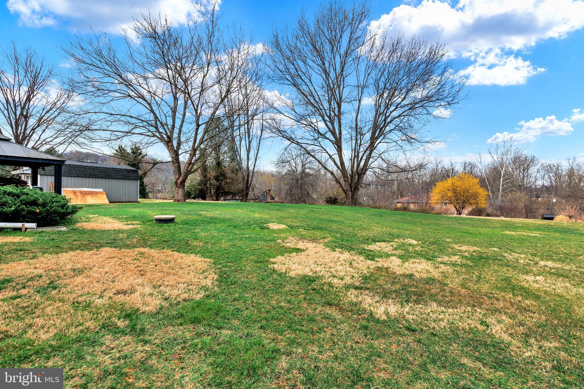41 Apache Lane Willow Street, PA 17584 - Photo 26 of 26 a backyard of a house with table and chairs