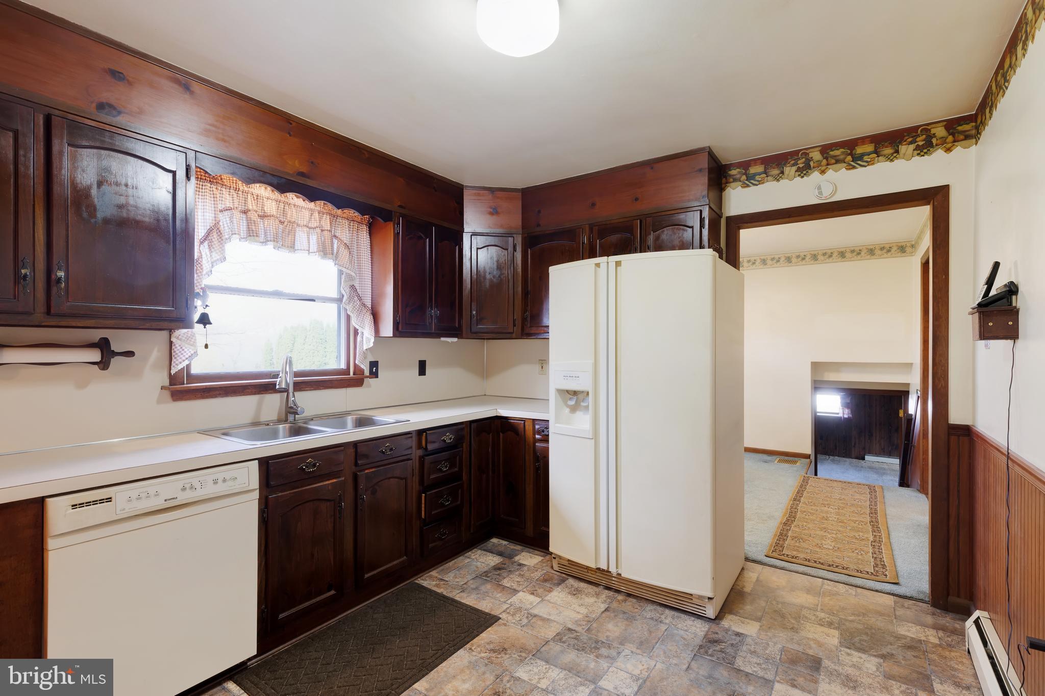 41 Apache Lane Willow Street, PA 17584 - Photo 3 of 26 a kitchen with a refrigerator sink and cabinets