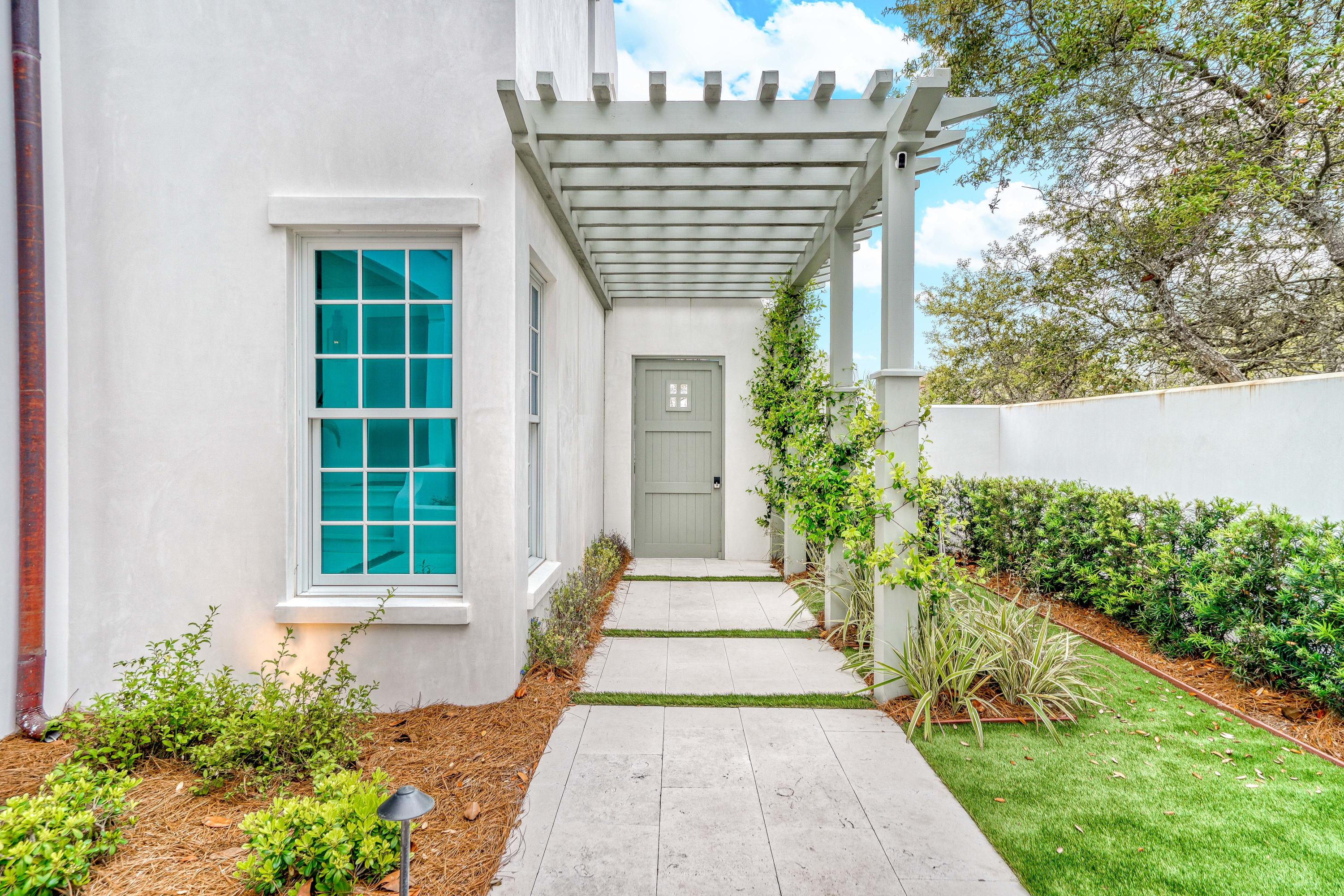 153 Pelican Cir Inlet Beach, Unit A Inlet Beach, FL 32461 - Photo 11 of 94 a front view of a house with garden