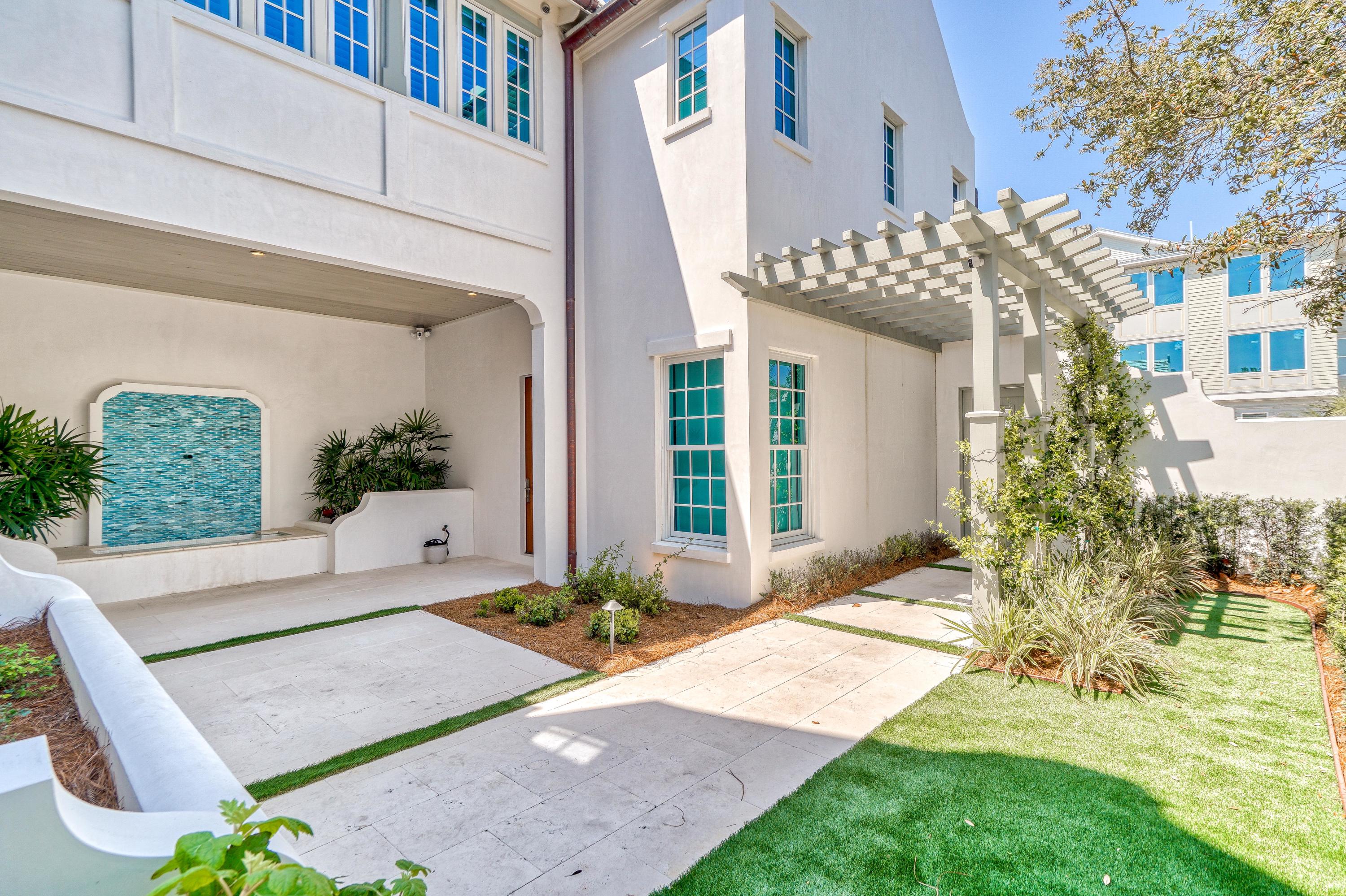 153 Pelican Cir Inlet Beach, Unit A Inlet Beach, FL 32461 - Photo 13 of 94 a front view of a house with a yard