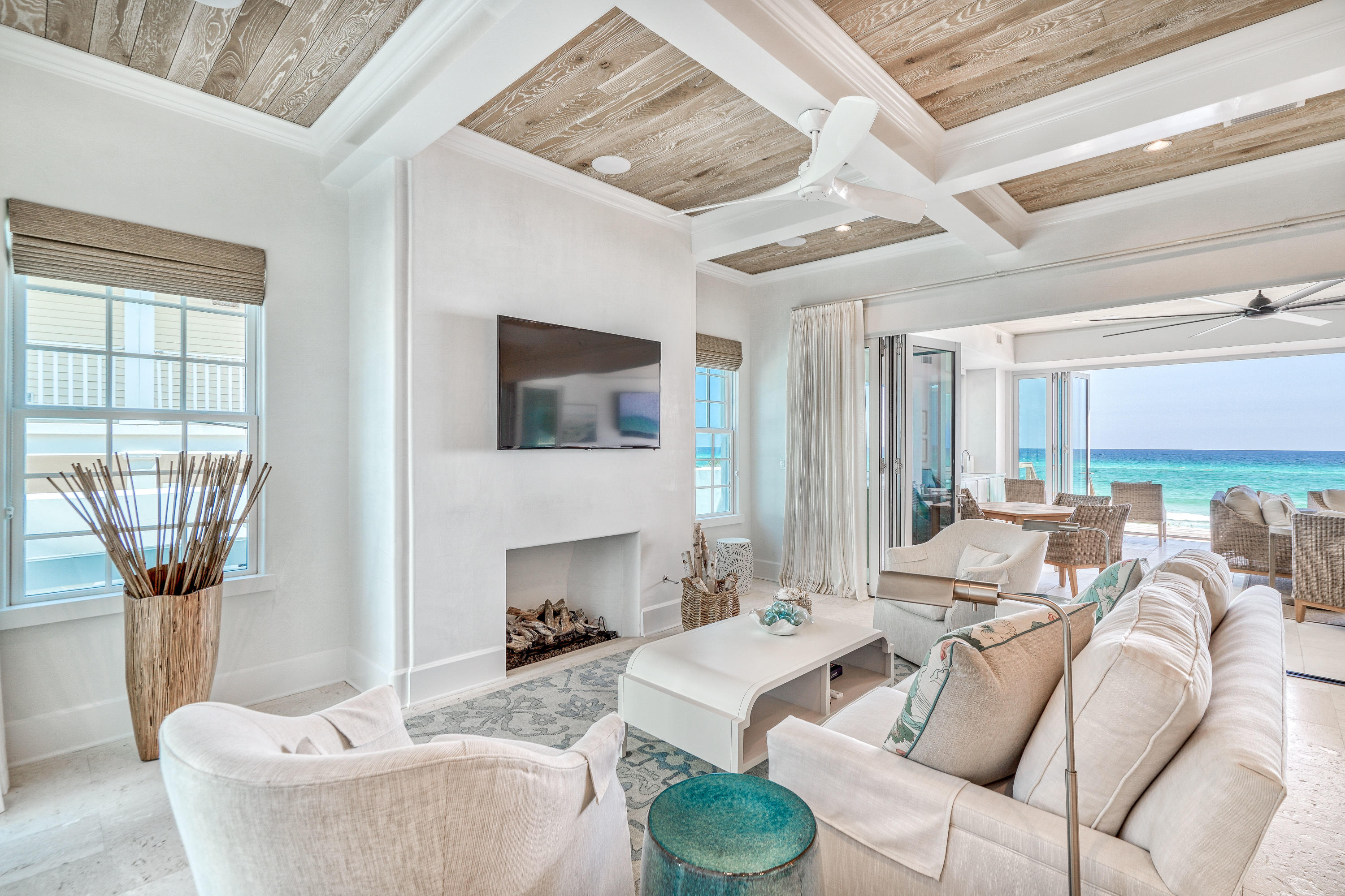 153 Pelican Cir Inlet Beach, Unit A Inlet Beach, FL 32461 - Photo 38 of 94 a living room with furniture a fireplace and a flat screen tv