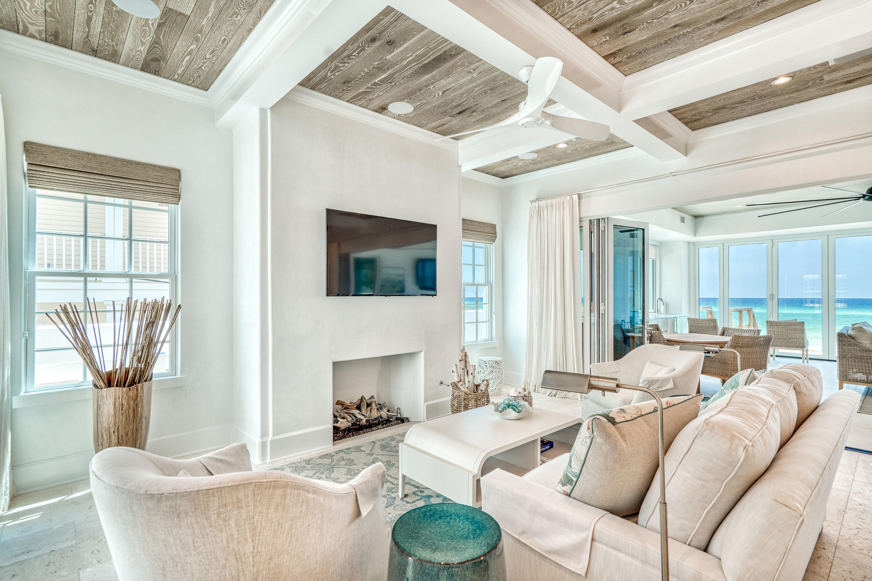 153 Pelican Cir Inlet Beach, Unit A Inlet Beach, FL 32461 - Photo 40 of 94 a living room with furniture a fireplace and a flat screen tv