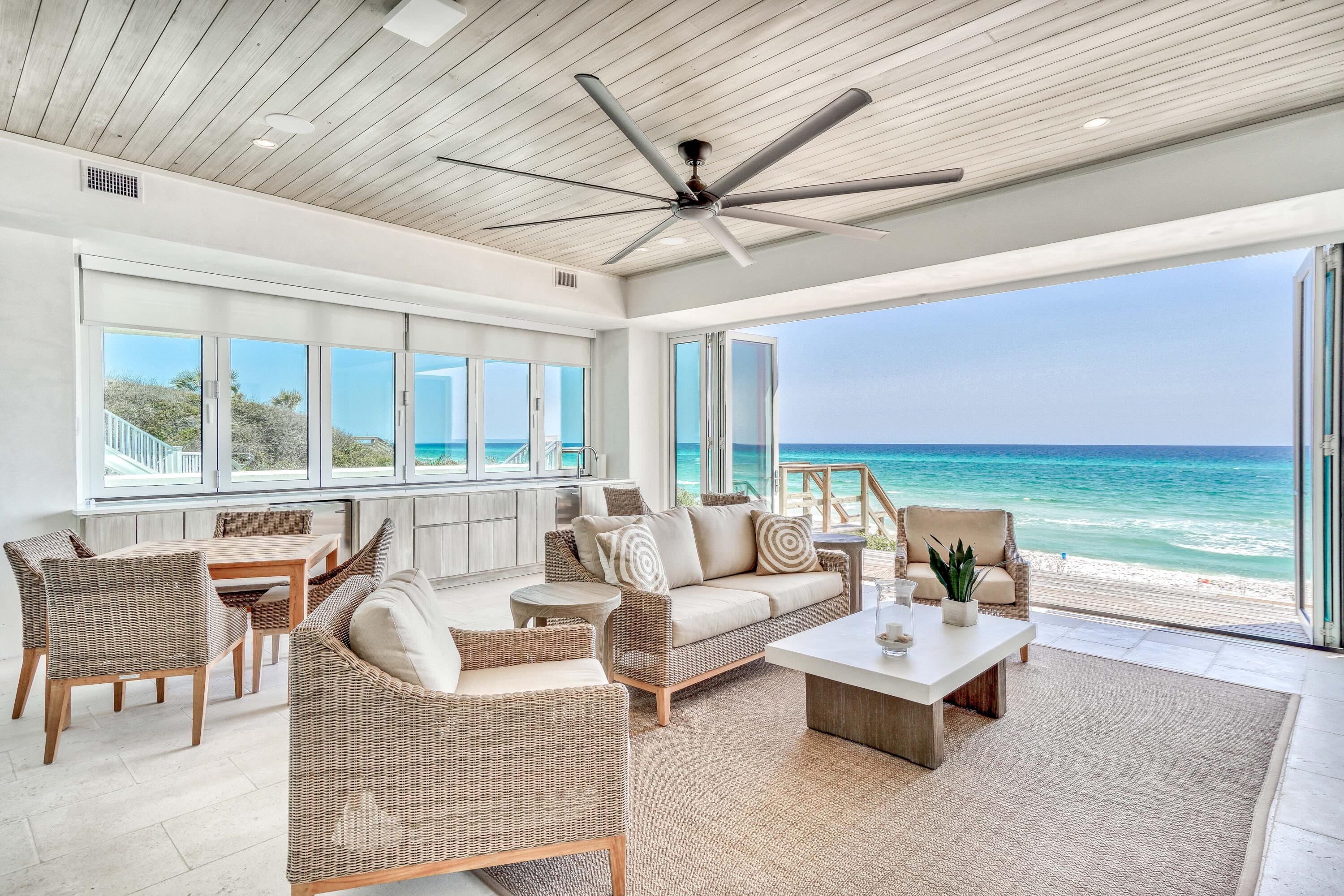 153 Pelican Cir Inlet Beach, Unit A Inlet Beach, FL 32461 - Photo 45 of 94 a living room with furniture and a floor to ceiling window