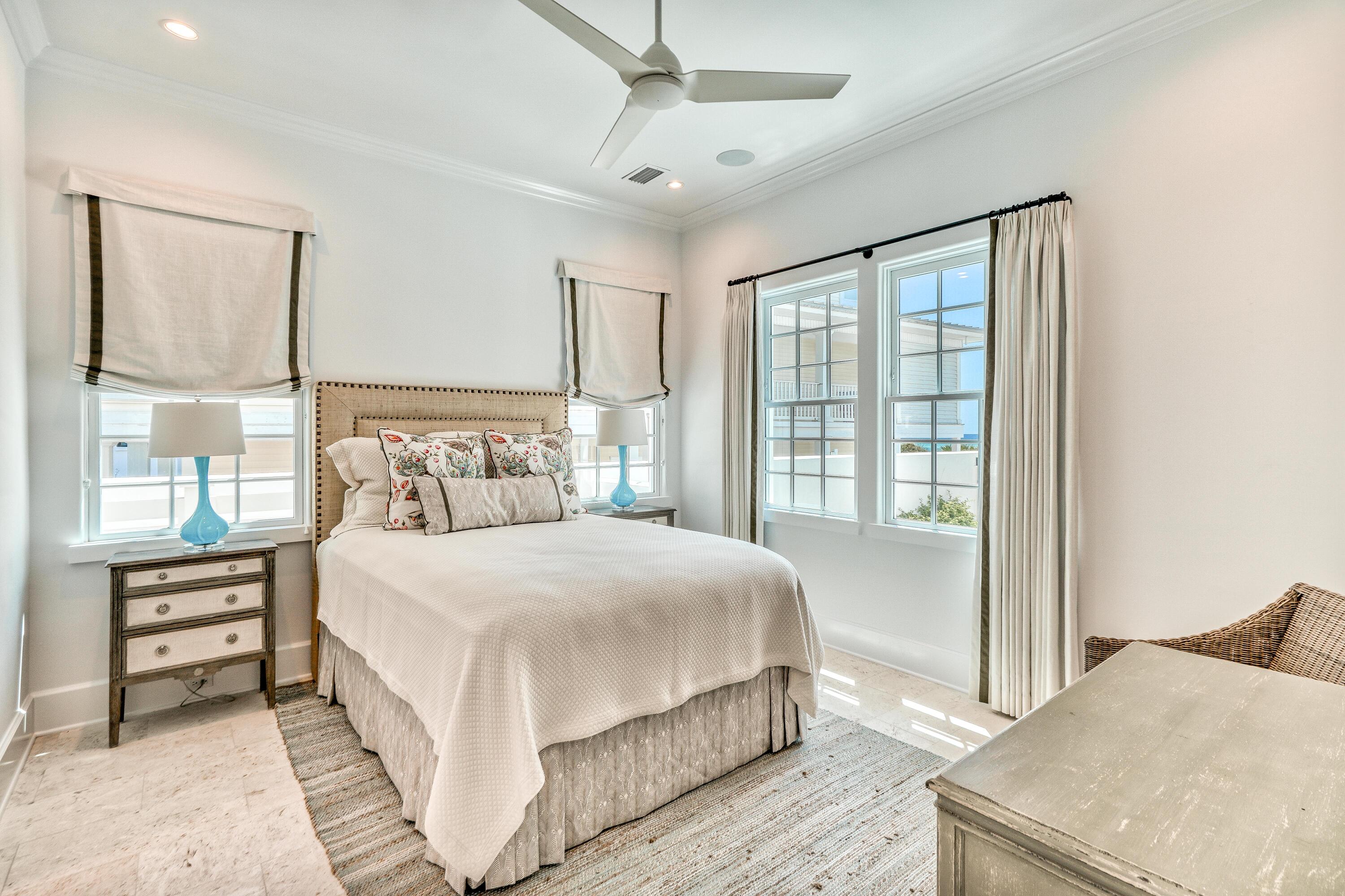 153 Pelican Cir Inlet Beach, Unit A Inlet Beach, FL 32461 - Photo 49 of 94 a bedroom with a large bed and a large window