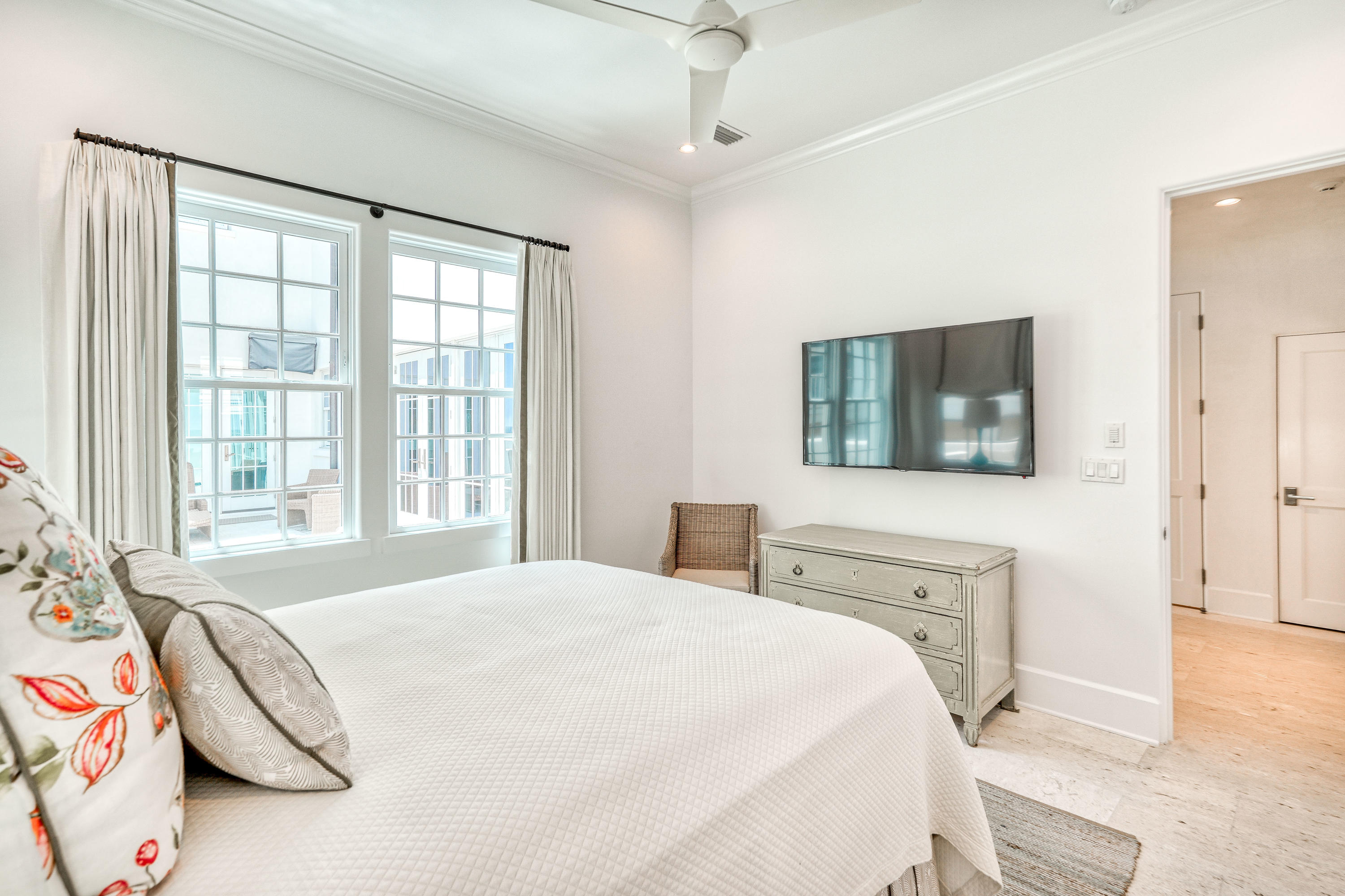 153 Pelican Cir Inlet Beach, Unit A Inlet Beach, FL 32461 - Photo 50 of 94 a bedroom with a large bed and a flat tv screen on dresser