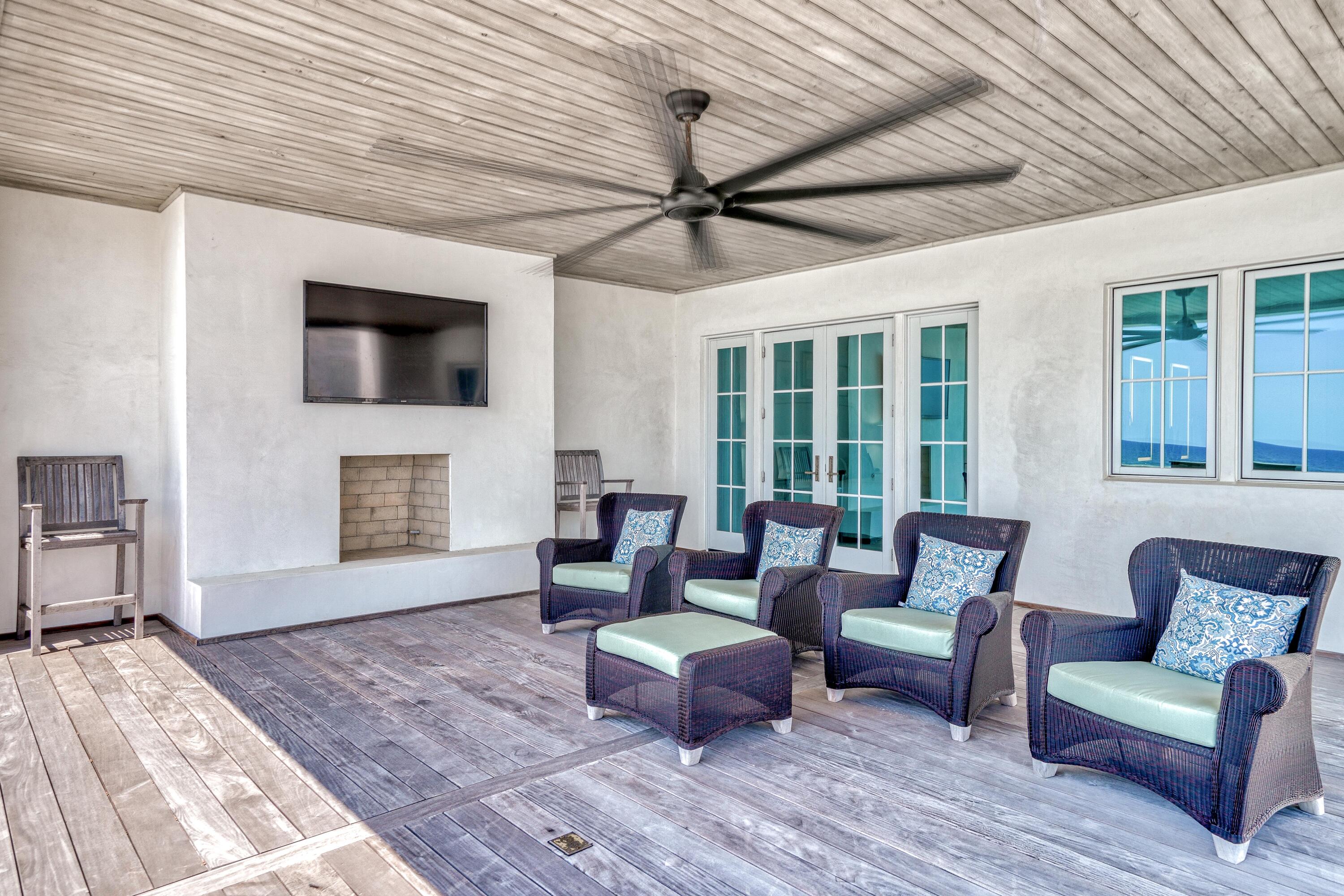 153 Pelican Cir Inlet Beach, Unit A Inlet Beach, FL 32461 - Photo 69 of 94 a living room with furniture a fireplace and a flat screen tv
