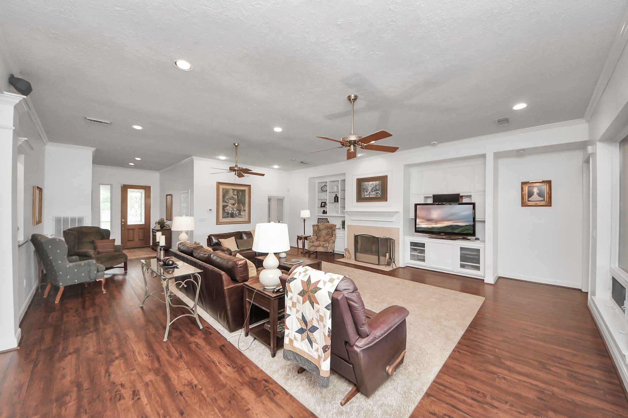 7511 County Road 511 Rosharon, TX 77583 - Photo 13 of 42 a living room with fireplace furniture and a wooden floor
