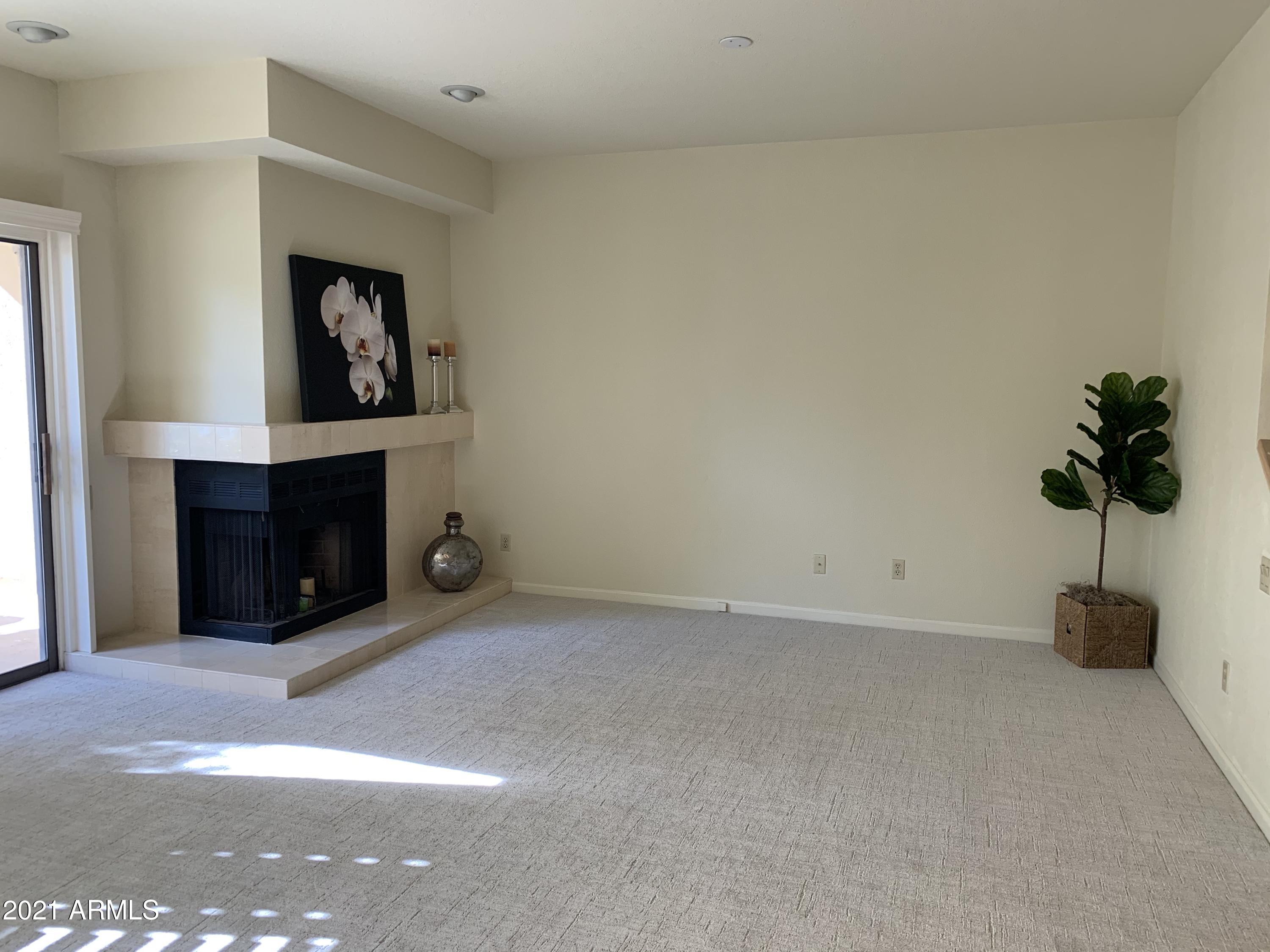 7272 East Gainey Ranch Road, Unit 114 Scottsdale, AZ 85258 - Photo 10 of 70 LIVING ROOM W WOOD BURNING FIREPLACE