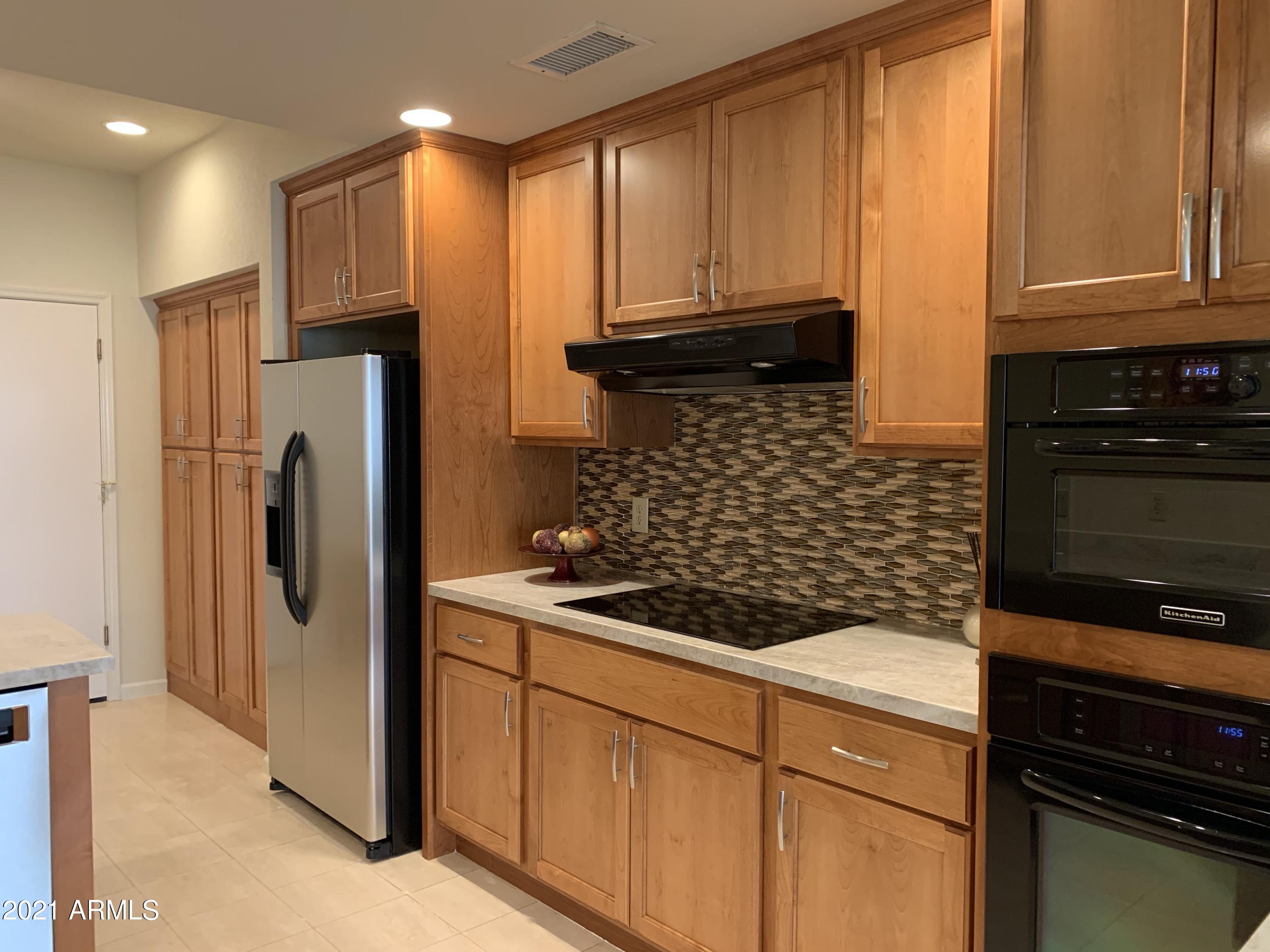 7272 East Gainey Ranch Road, Unit 114 Scottsdale, AZ 85258 - Photo 14 of 70 DIRECT ACCESS INTO KITCHEN FROM 2CGARAGE