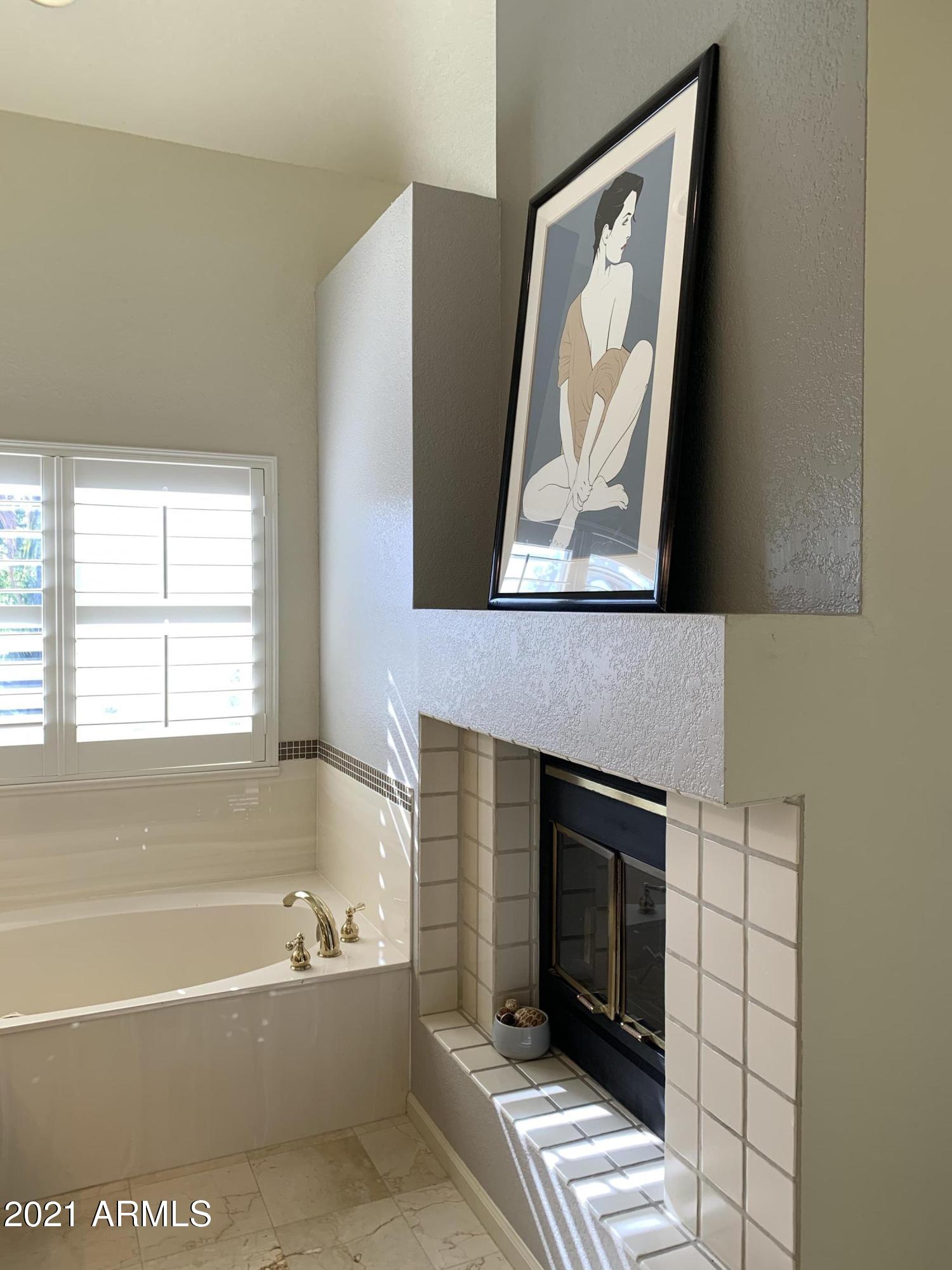 7272 East Gainey Ranch Road, Unit 114 Scottsdale, AZ 85258 - Photo 42 of 70 2-WAY FIREPLACE IN MASTER BATH