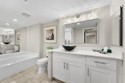 an aerial view of residential houses with outdoor space and swimming pool