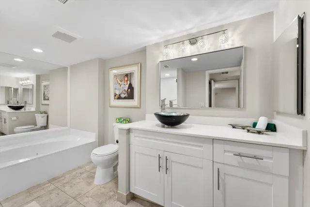 an aerial view of residential houses with outdoor space and swimming pool