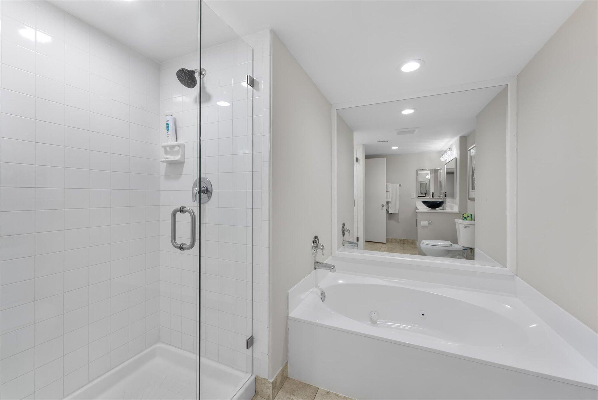 30 Westgate Lane, Unit 30G Boynton Beach, FL 33436 - Photo 16 of 58 a bathroom with a bathtub and a shower