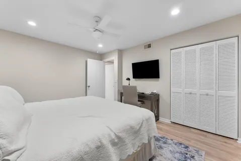 an aerial view of residential houses with outdoor space and river