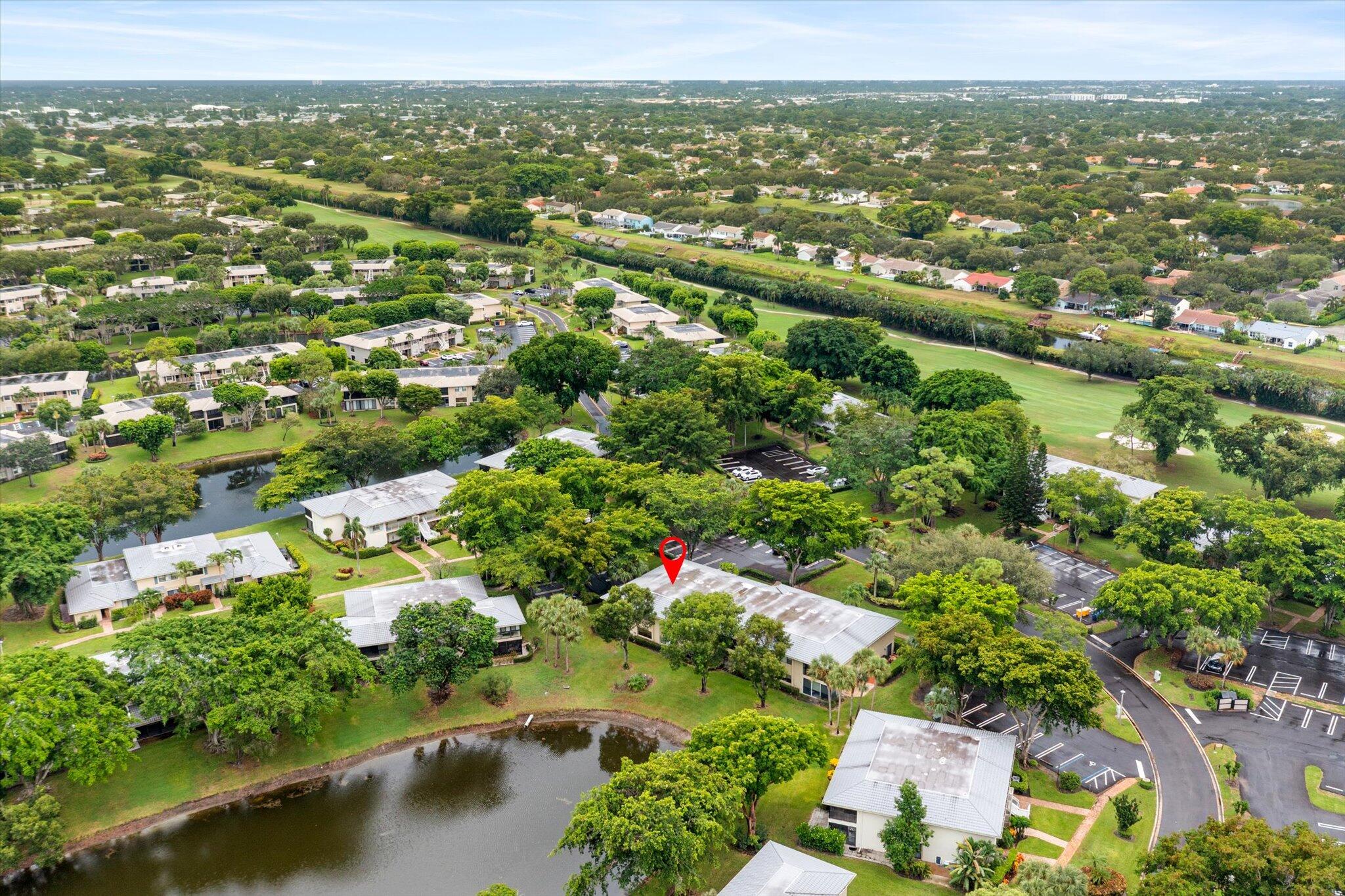 30 Westgate Lane, Unit 30G Boynton Beach, FL 33436 - Photo 33 of 58 an aerial view of residential houses with outdoor space and swimming pool