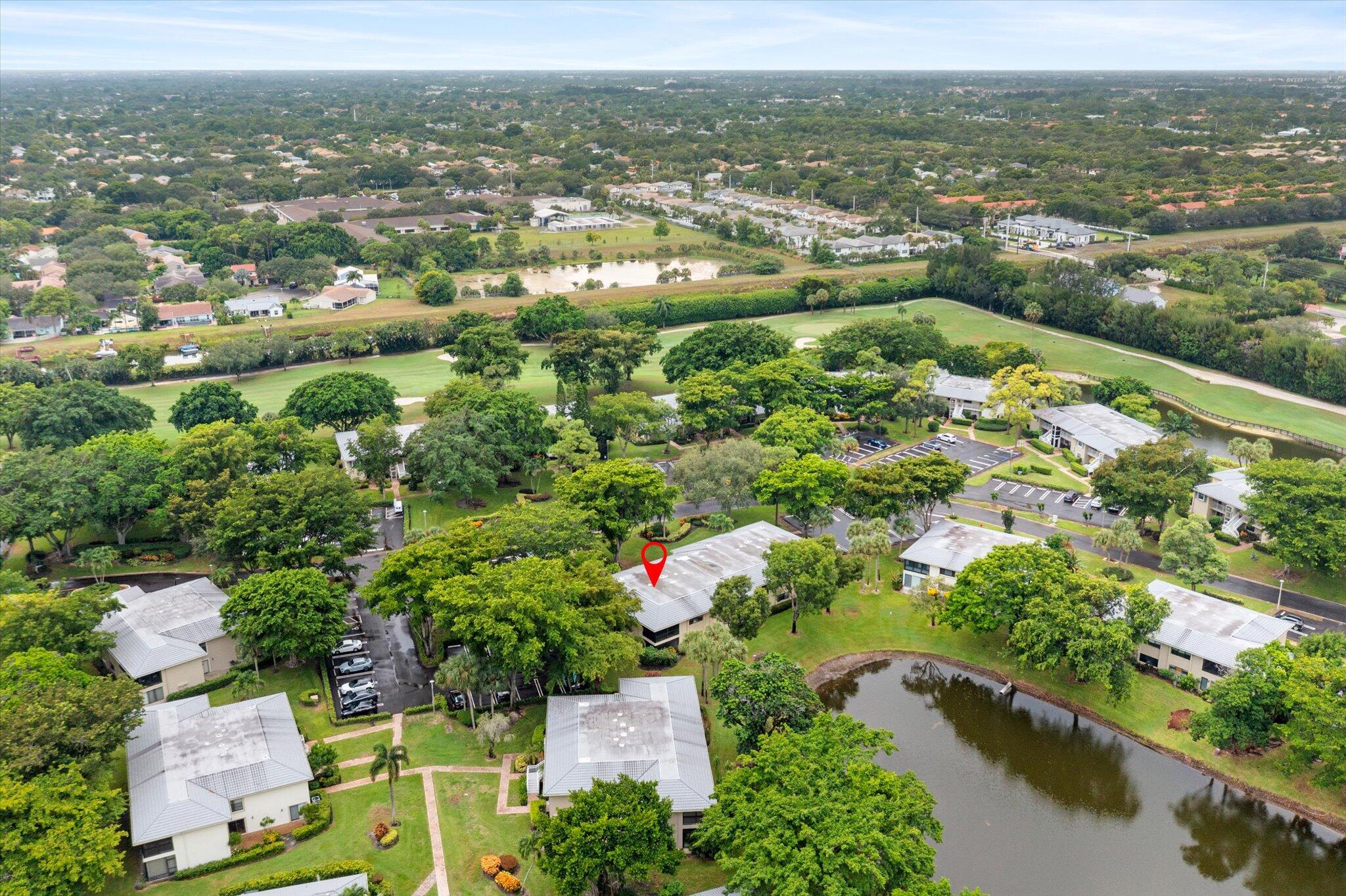 30 Westgate Lane, Unit 30G Boynton Beach, FL 33436 - Photo 34 of 58 an aerial view of residential houses with outdoor space and trees