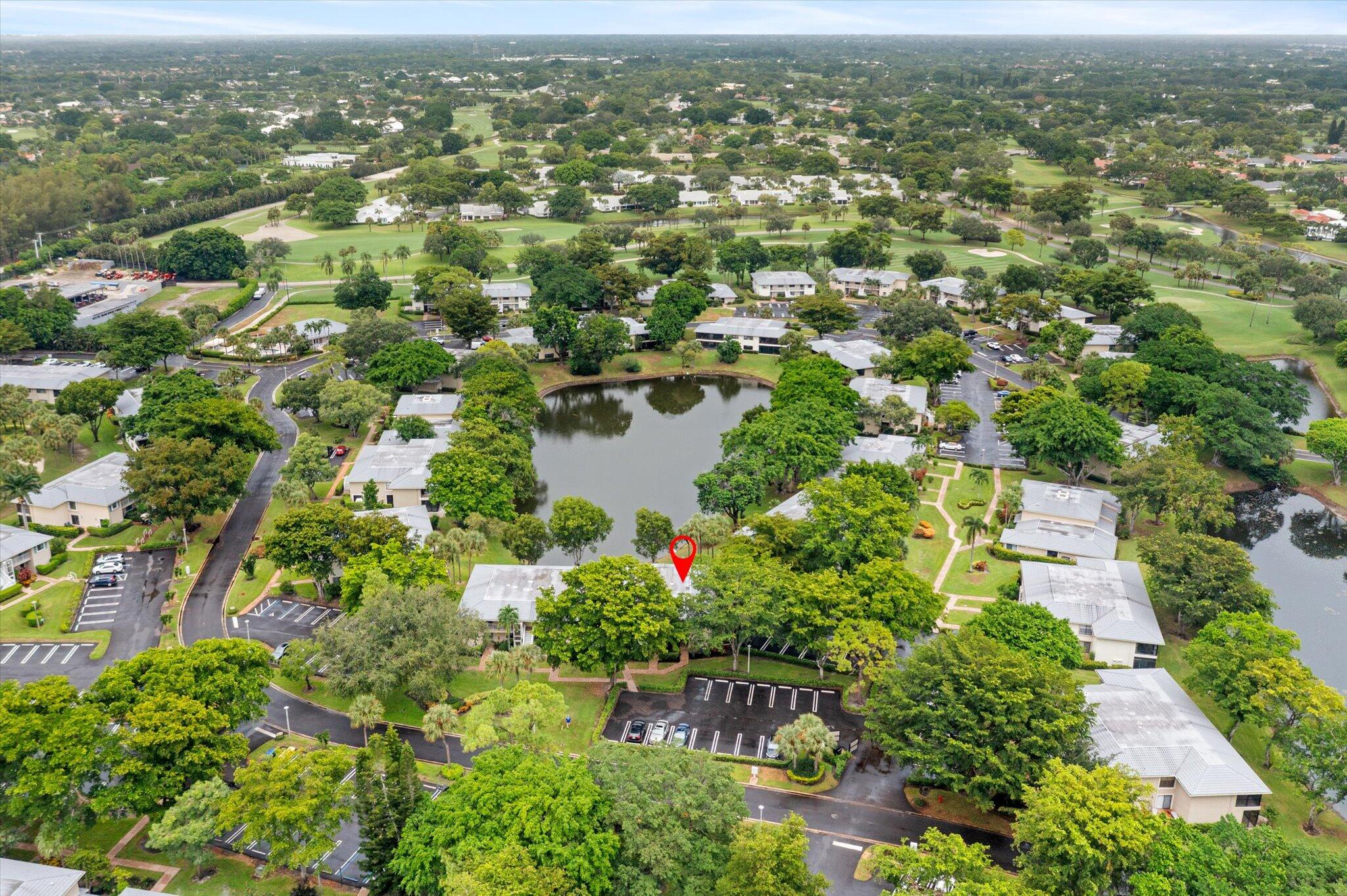 30 Westgate Lane, Unit 30G Boynton Beach, FL 33436 - Photo 36 of 58 an aerial view of residential houses with outdoor space and trees