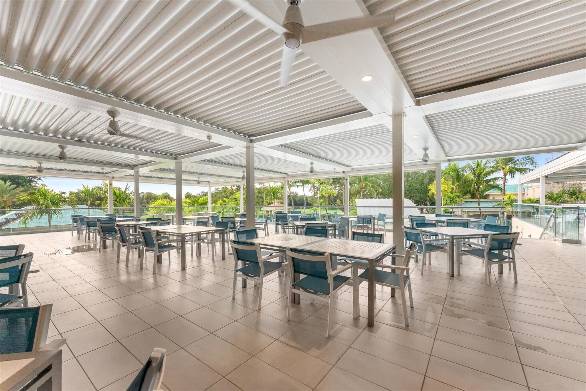 30 Westgate Lane, Unit 30G Boynton Beach, FL 33436 - Photo 47 of 58 a dining space with furniture and outdoor view