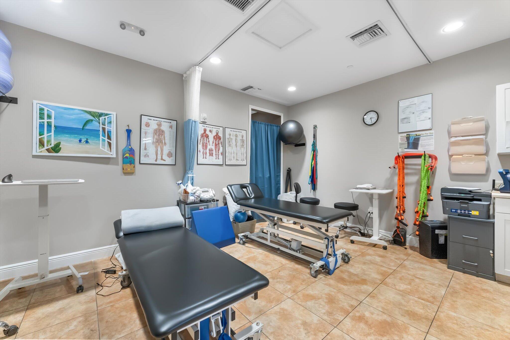 30 Westgate Lane, Unit 30G Boynton Beach, FL 33436 - Photo 56 of 58 a living room with furniture gym equipment and a flat screen tv