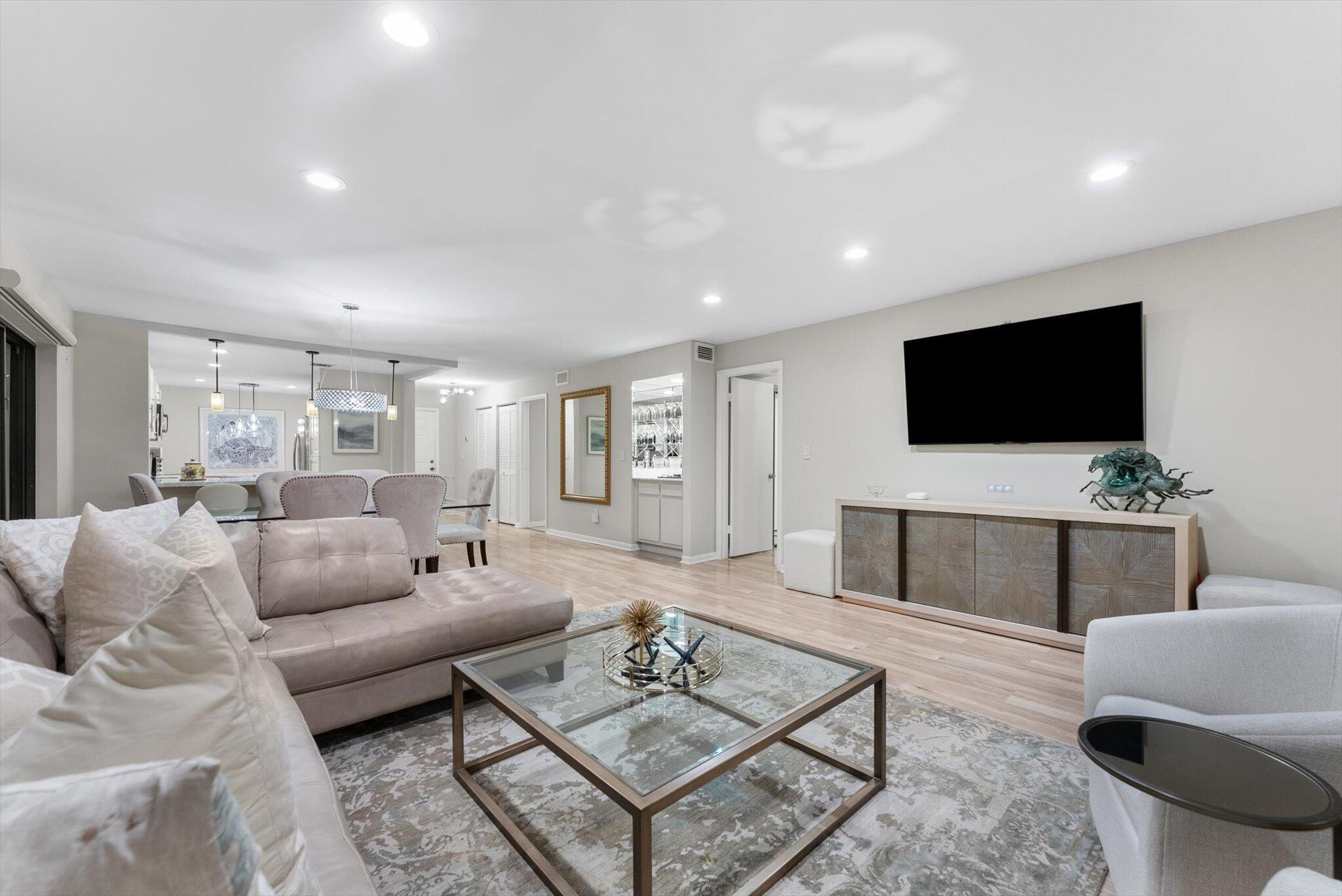 30 Westgate Lane, Unit 30G Boynton Beach, FL 33436 - Photo 9 of 58 a living room with furniture and a flat screen tv