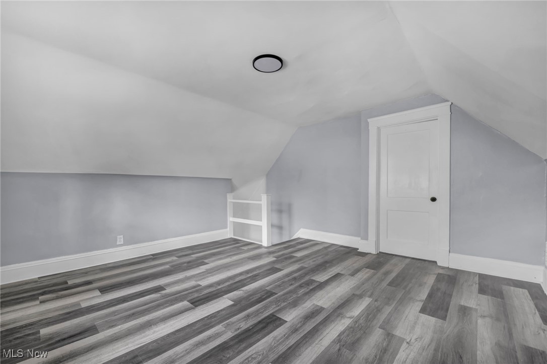 10112 Kinsman Road Cleveland, OH 44104 - Photo 44 of 49 Bonus room with wood finished floors and lofted ceiling