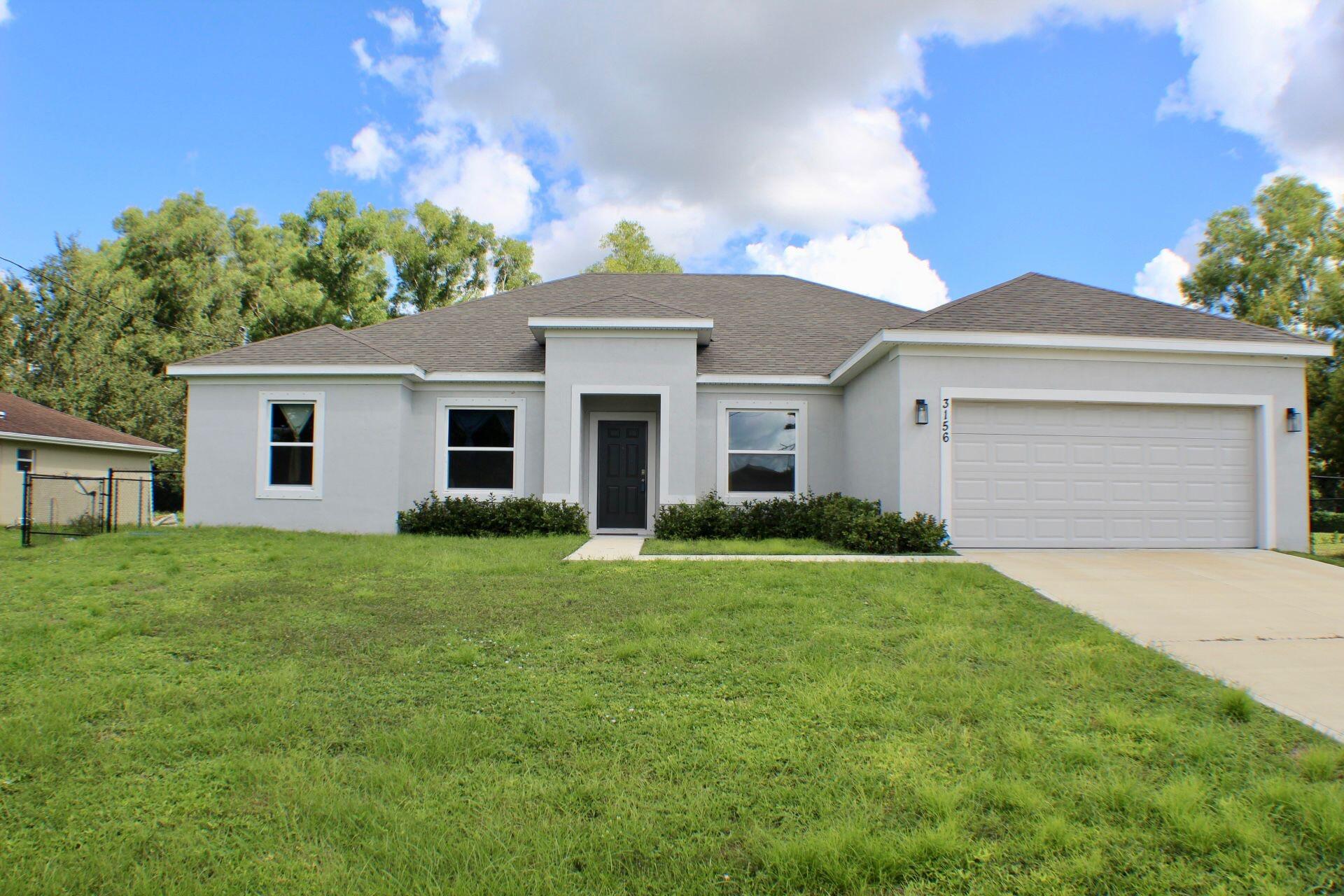 3156 Southwest Ann Arbor Road Port St. Lucie, FL 34953 - Photo 1 of 14 Front of home