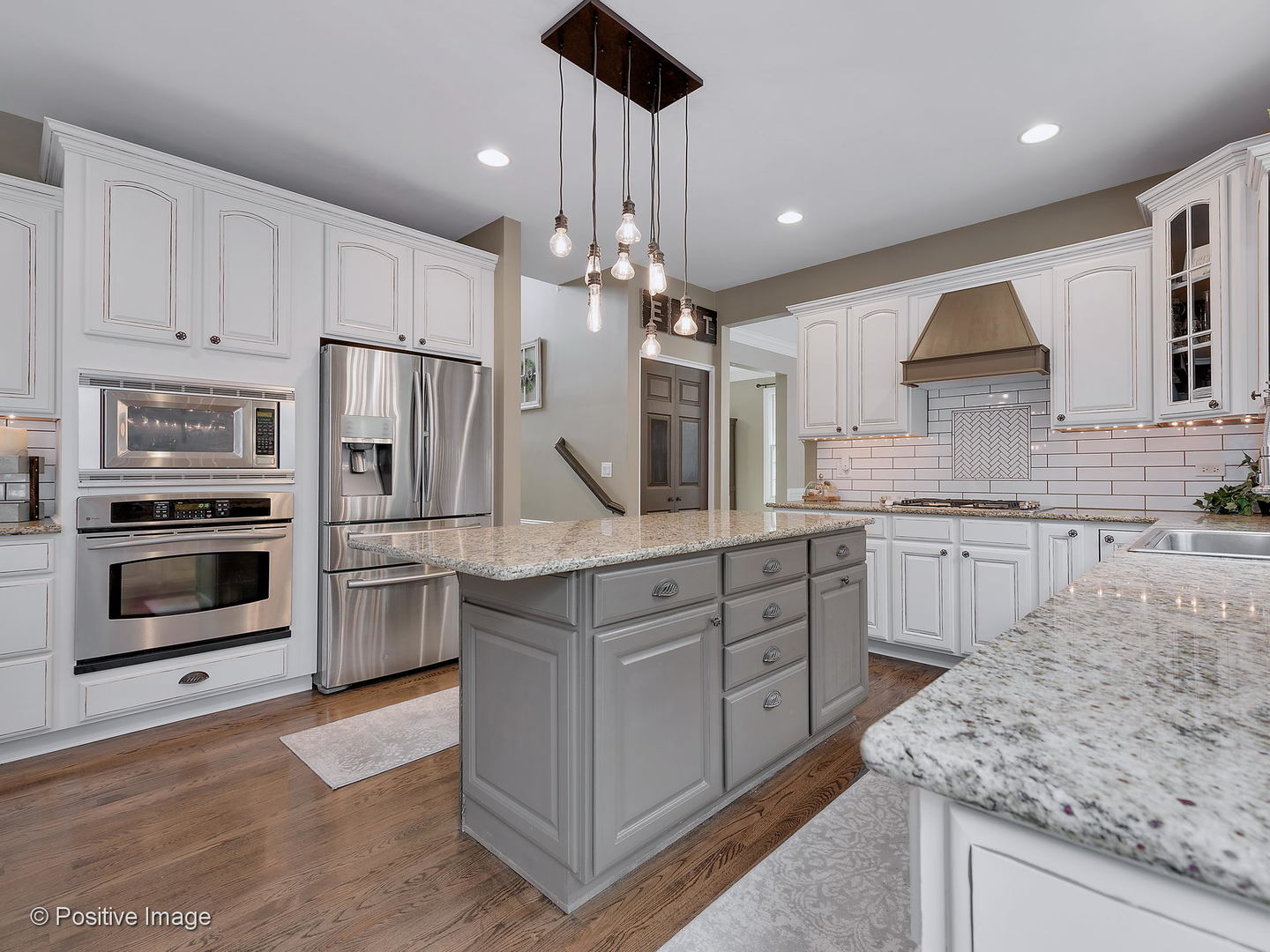 27W617 Garys Mill Road Winfield, IL 60190 - Photo 11 of 35 a kitchen with stainless steel appliances kitchen island granite countertop a stove and cabinets