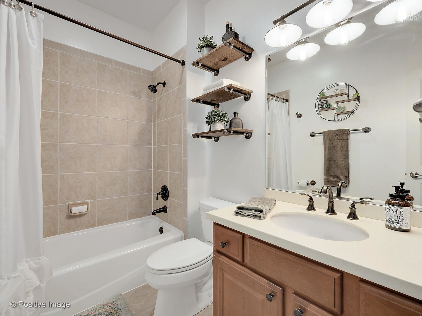 27W617 Garys Mill Road Winfield, IL 60190 - Photo 15 of 35 a bathroom with a sink a toilet and a mirror