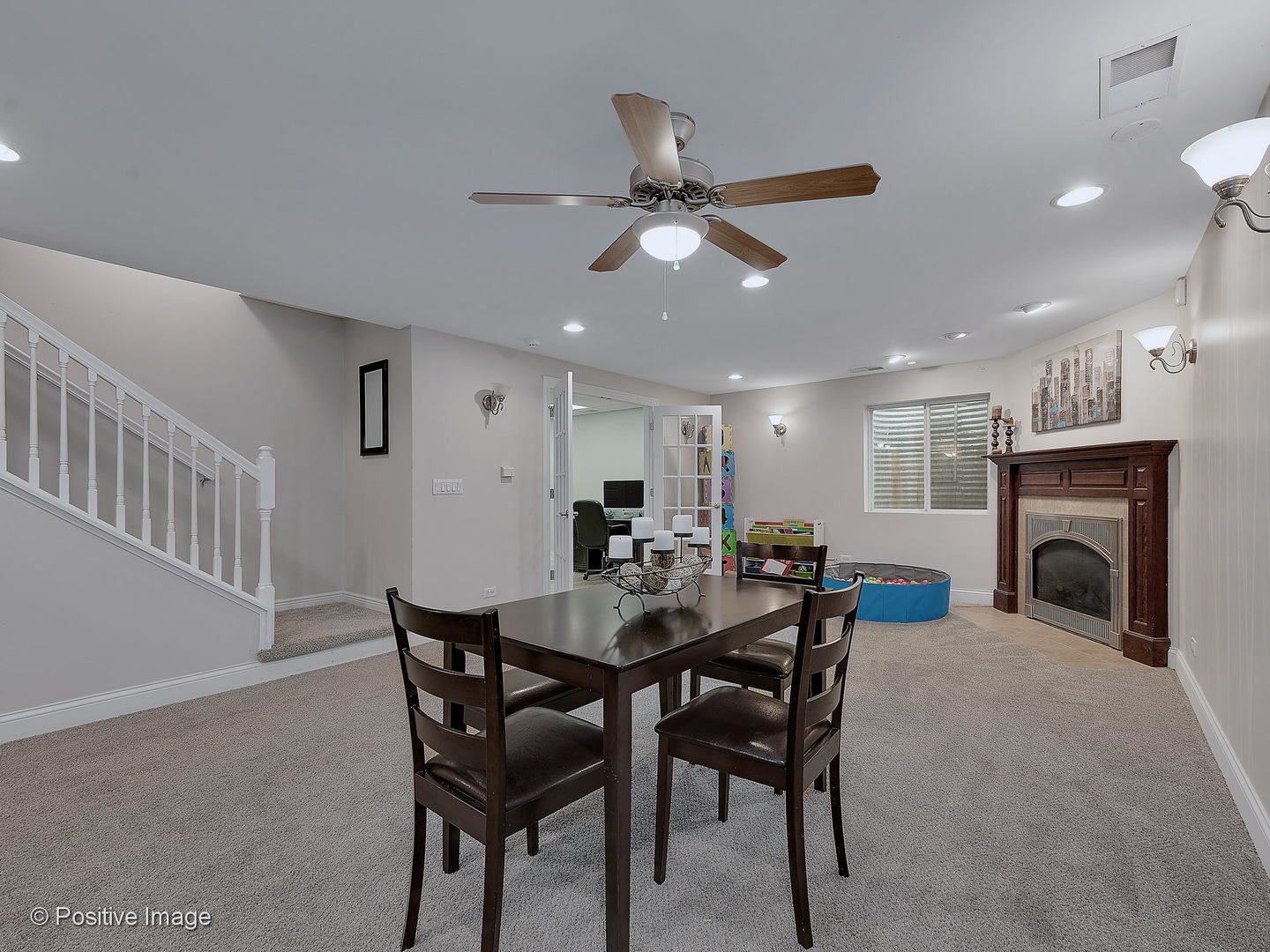 27W617 Garys Mill Road Winfield, IL 60190 - Photo 23 of 35 a view of a dining room with furniture and a fireplace