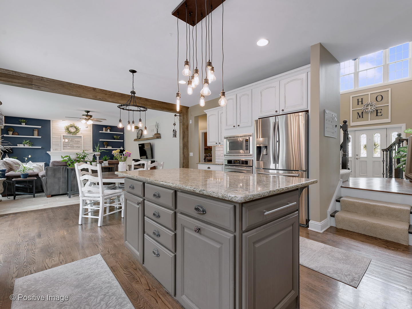 27W617 Garys Mill Road Winfield, IL 60190 - Photo 9 of 35 a kitchen with stainless steel appliances granite countertop table chairs and a refrigerator