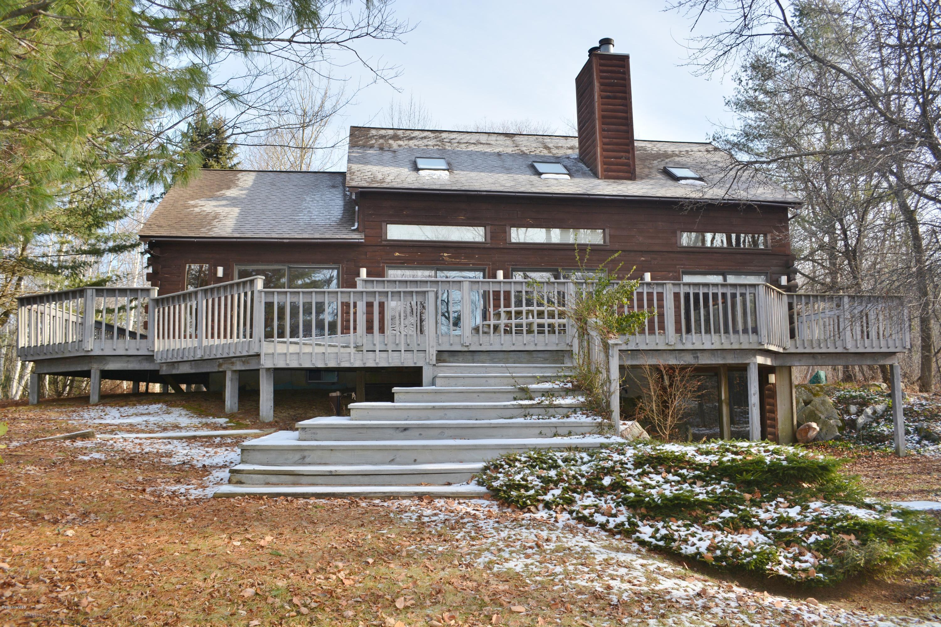 670 Bonny Rigg Hill Road Becket, MA 01223 - Photo 1 of 23 a front view of a building with garden