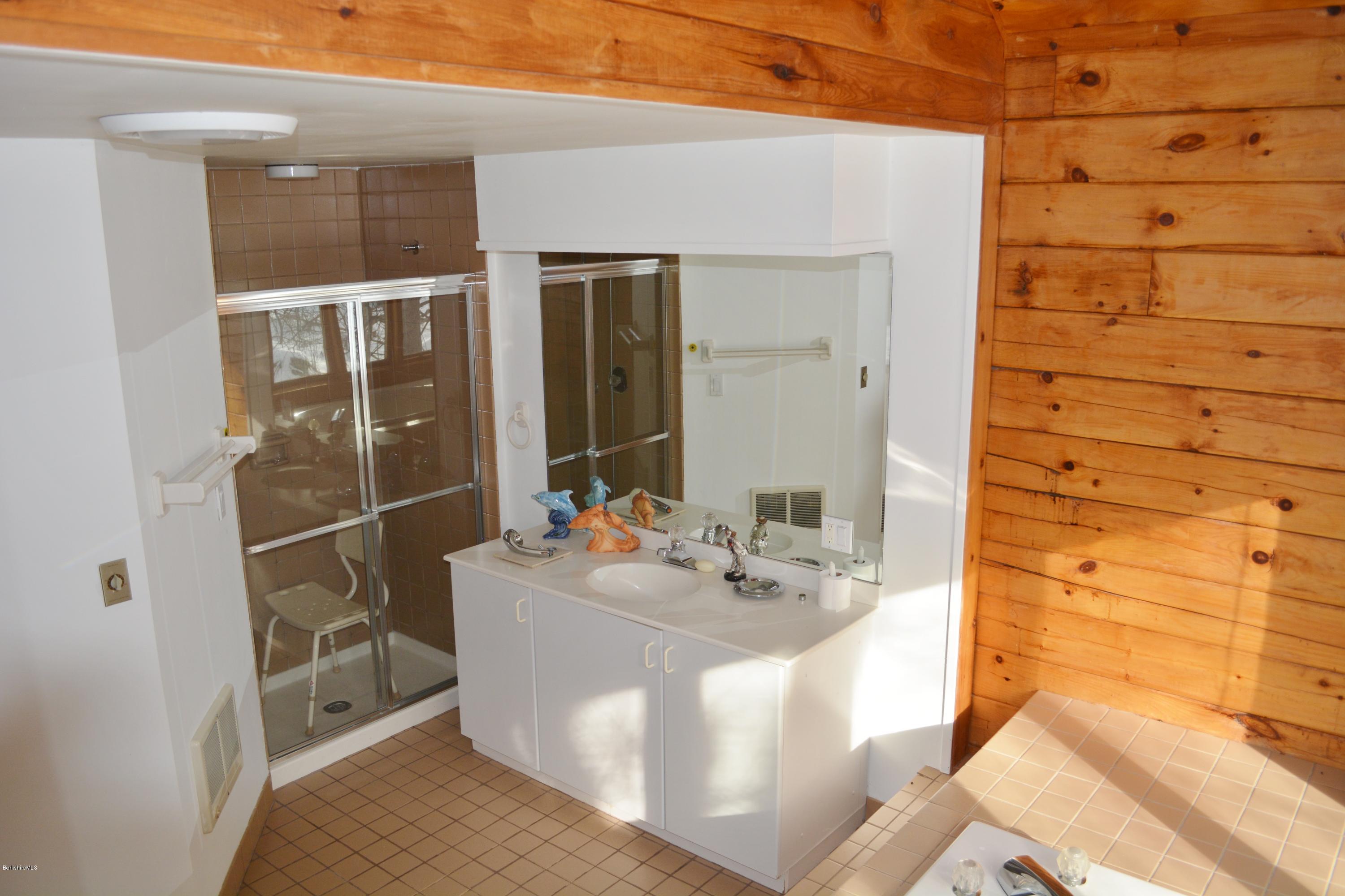 670 Bonny Rigg Hill Road Becket, MA 01223 - Photo 11 of 23 a bathroom with a sink and mirror