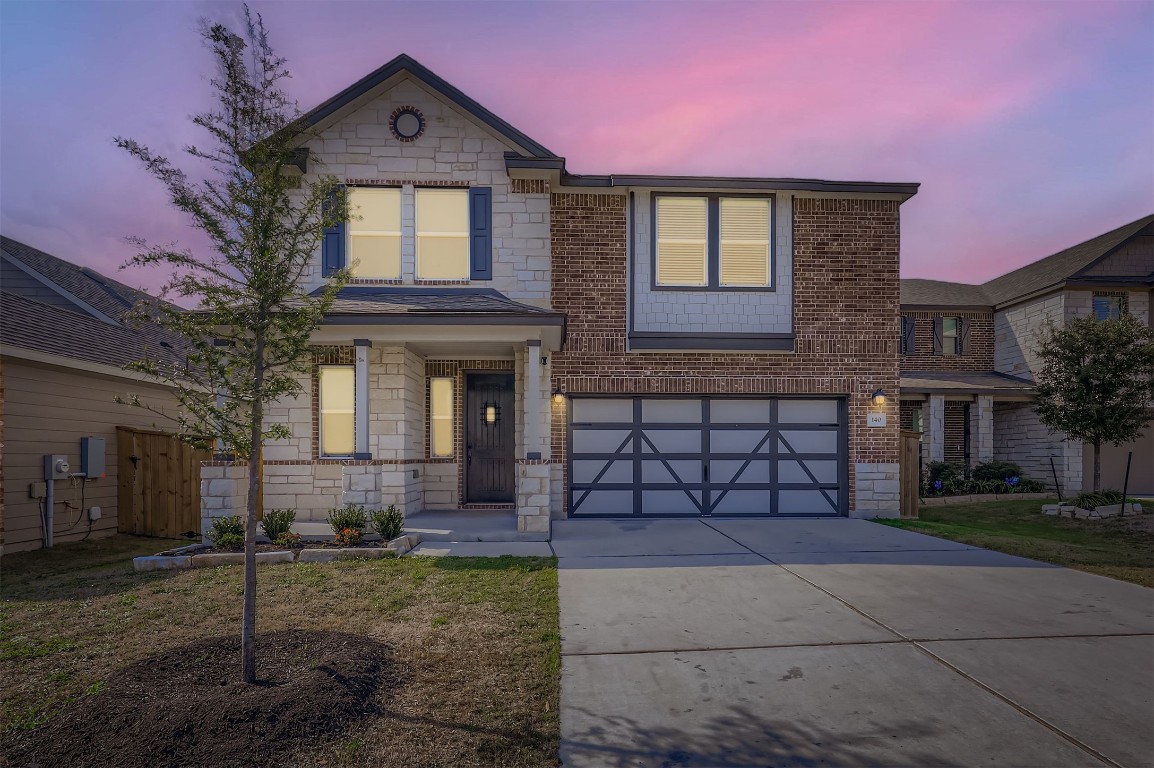 a front view of a house with a yard