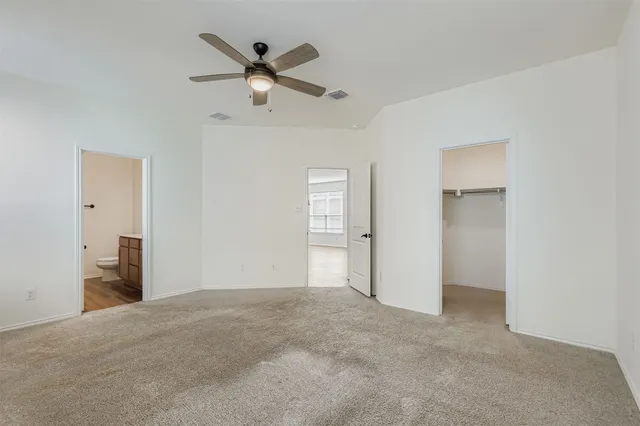 a kitchen with stainless steel appliances granite countertop a sink refrigerator and cabinets