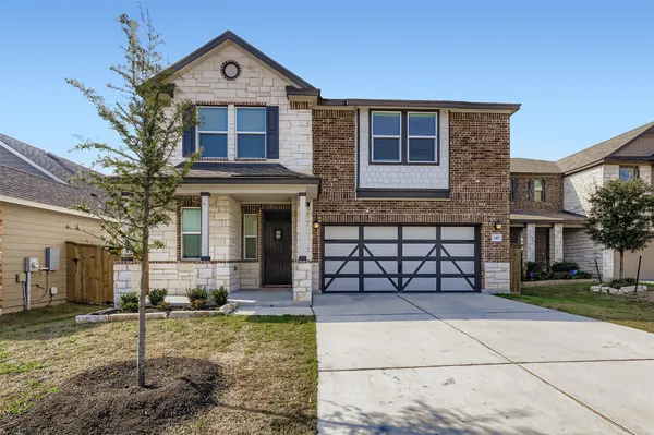 a view of a kitchen with cabinets and wooden floor
