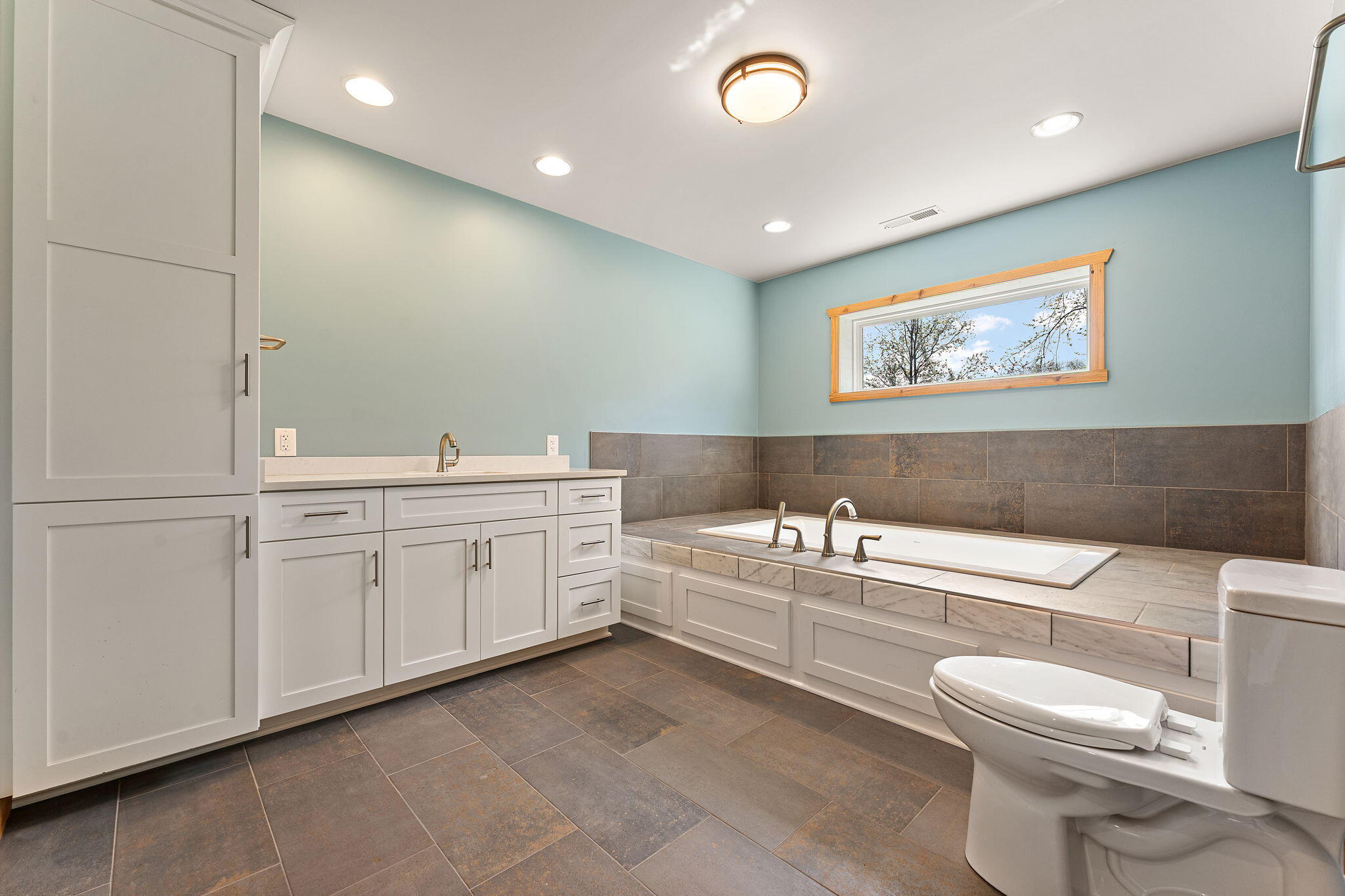 6631 Beach Street Knox, IN 46534 - Photo 16 of 41 a bathroom with a toilet a sink and mirror
