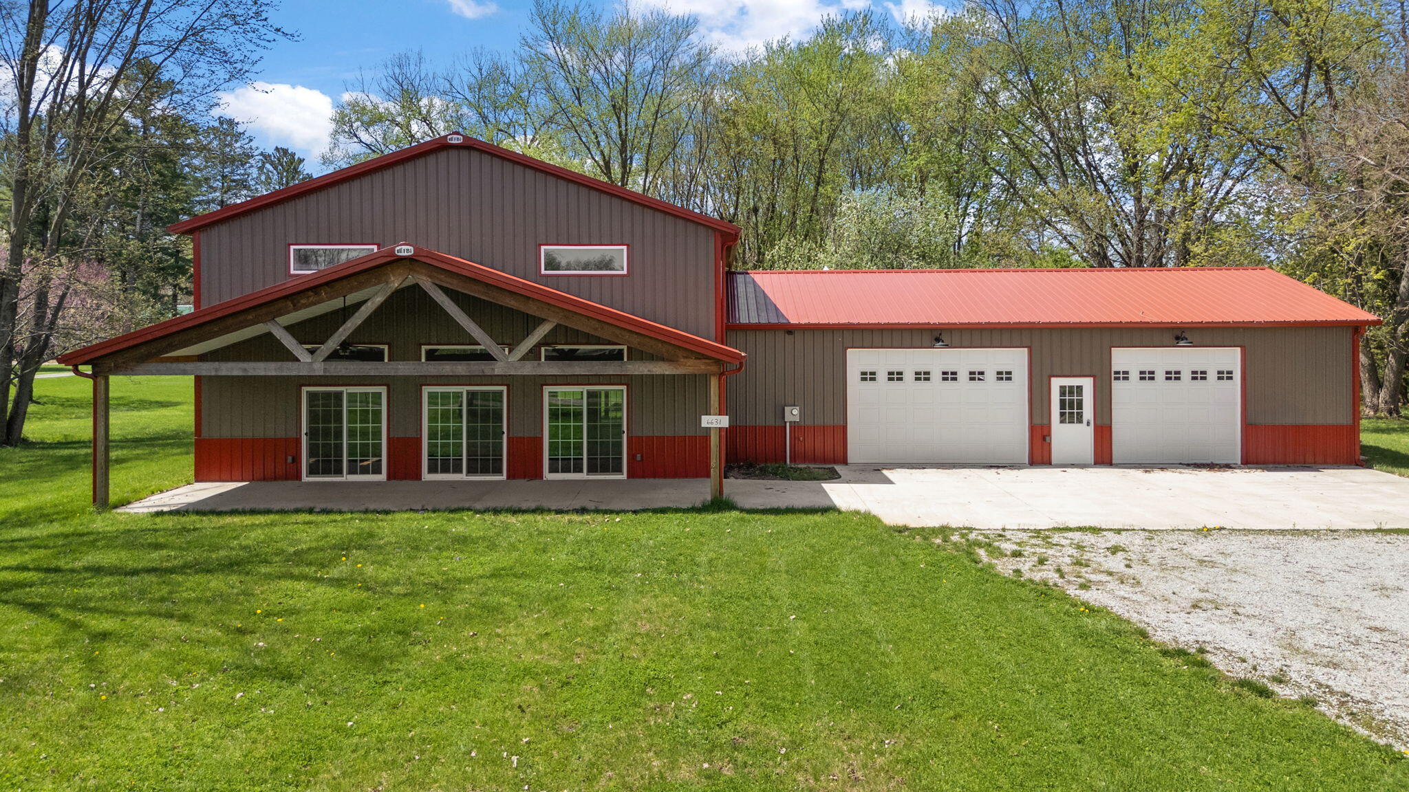 6631 Beach Street Knox, IN 46534 - Photo 2 of 41 a front view of a house with a yard
